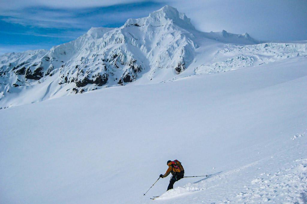 Skier gliding down the slope in a beautiful landscape