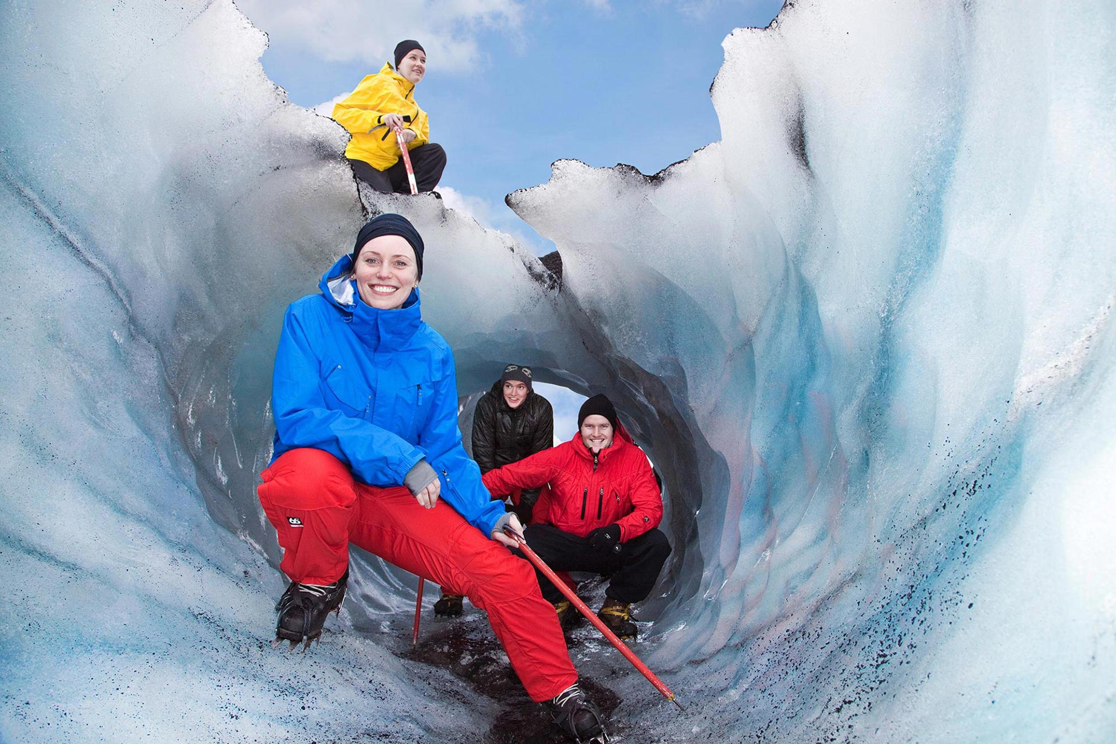  People posing inside Sólheimajökull glacier 
