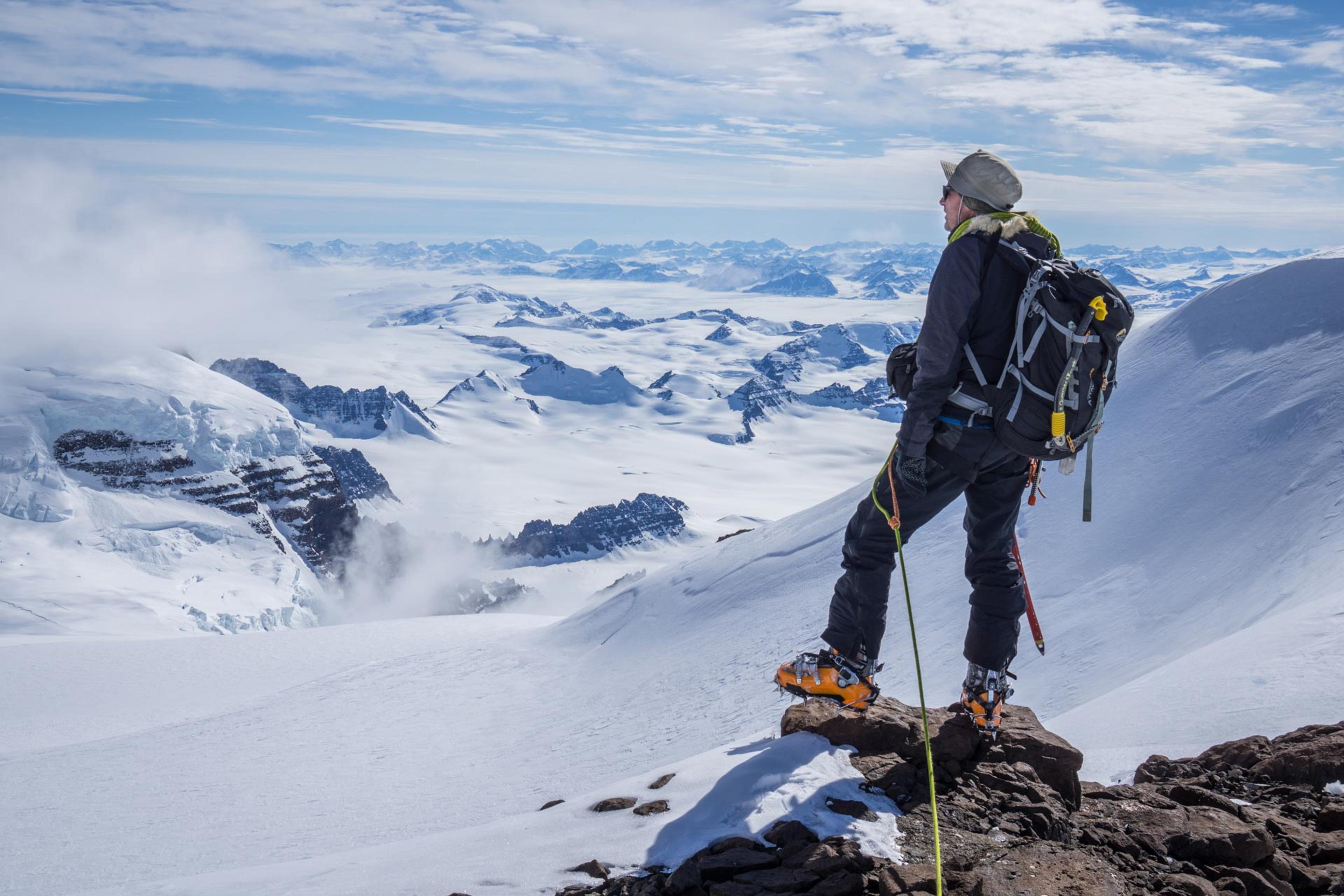 a man standing and looking at the amazing mountain view