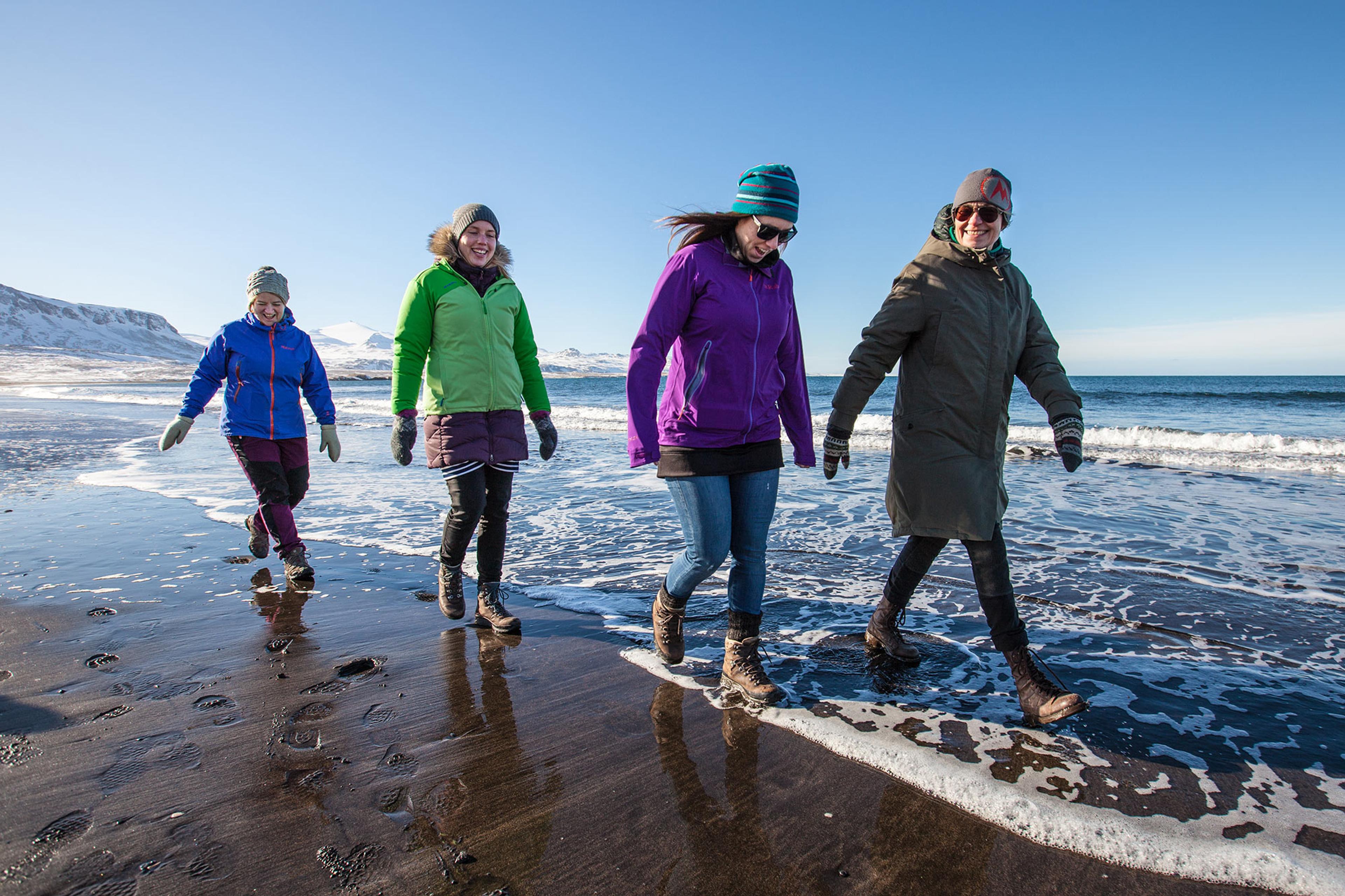 People walking on the beach in Snæfellsnes