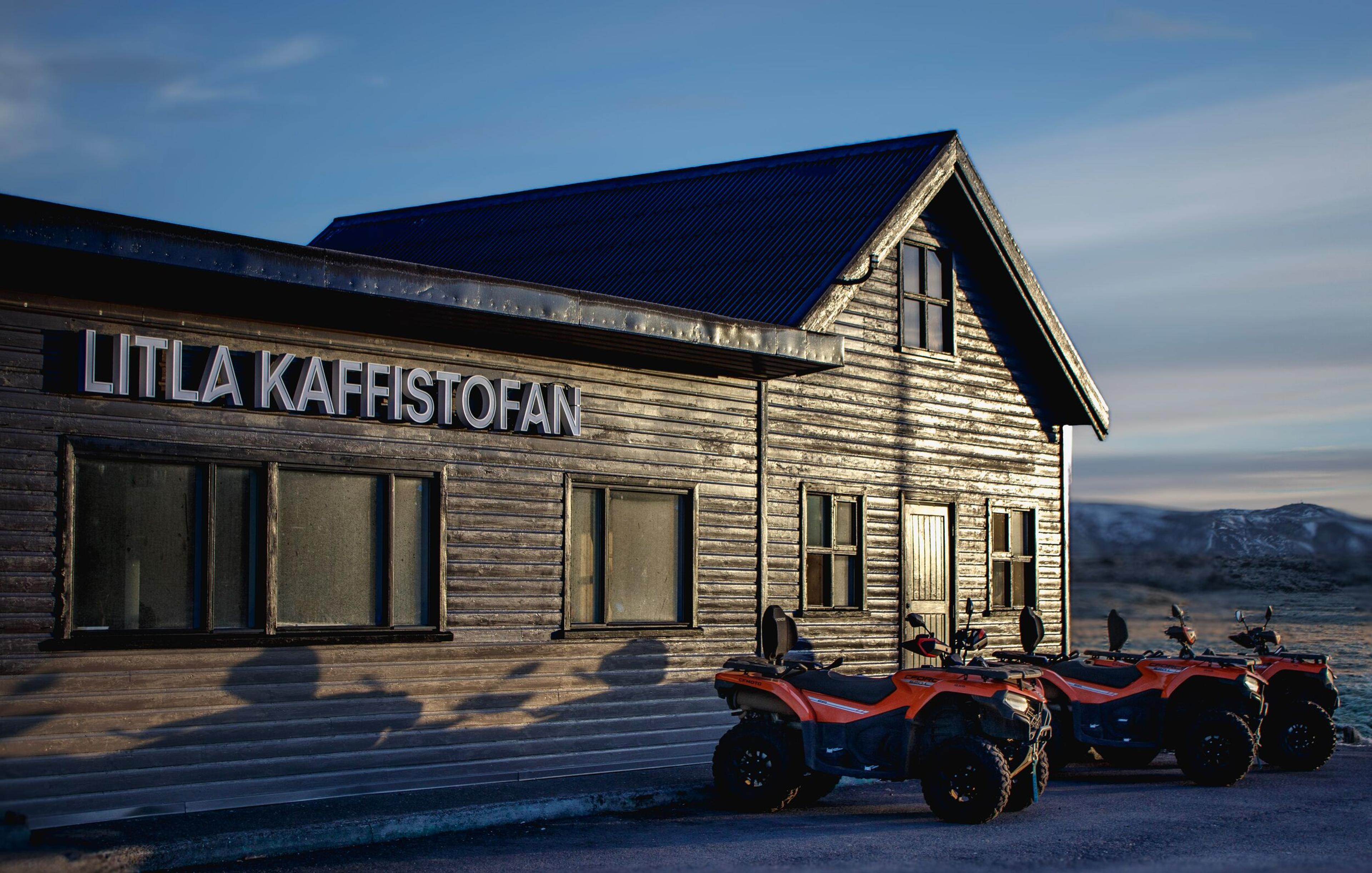 Three ATVs parked outside Litla Kaffistofan