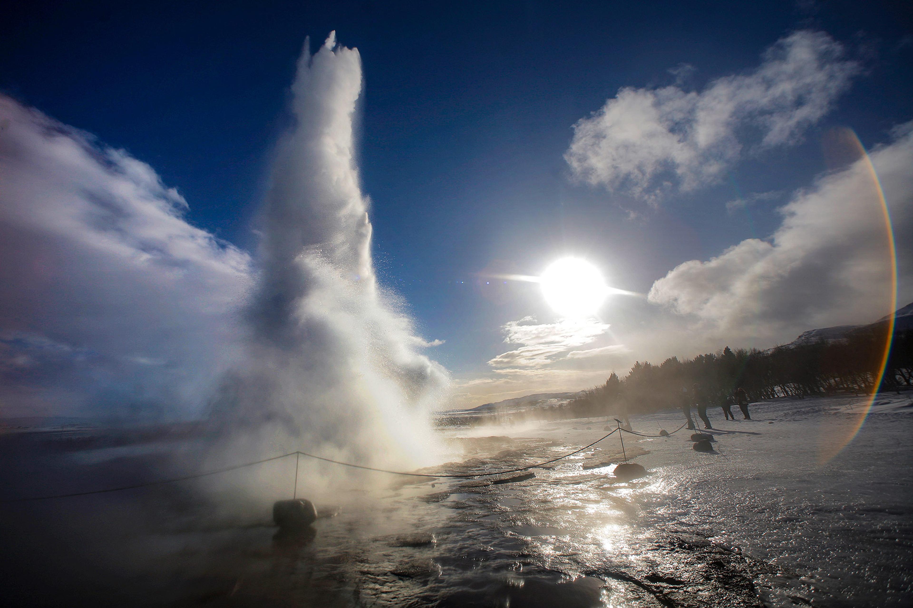 Geysir in the sun set under some cloud