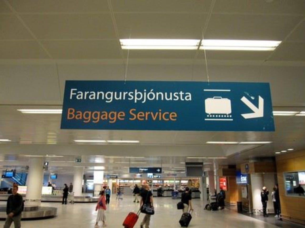 People walking around with suitcases in Keflavik airport in Iceland