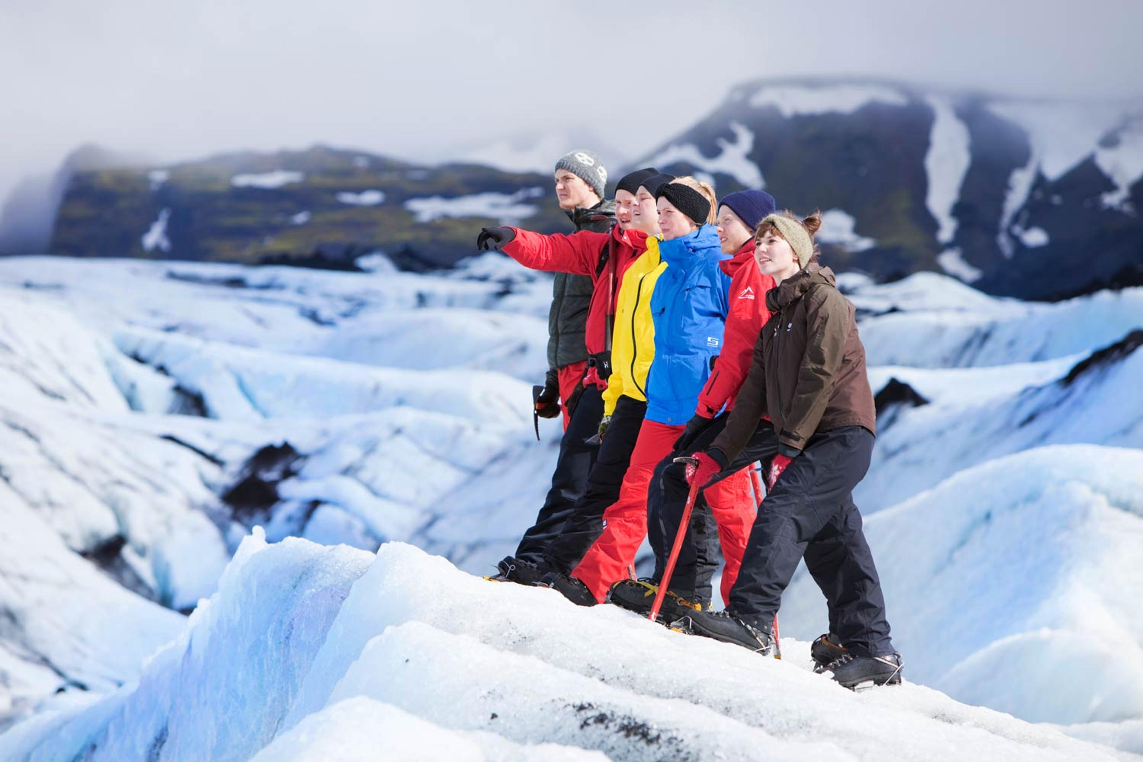 hikers in the snowy nature on a good day in Iceland