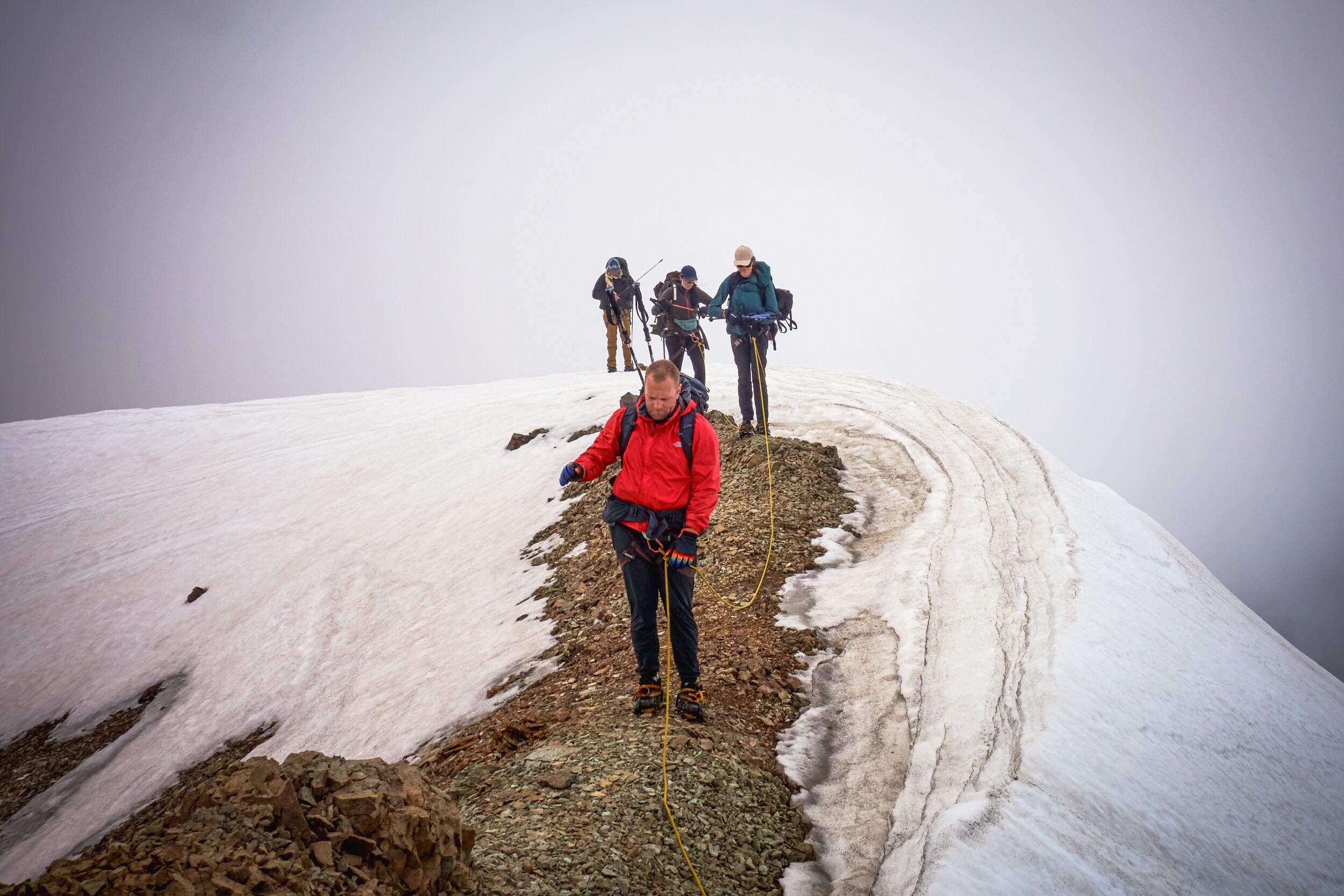 People hikig on snow