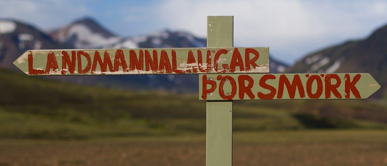 A sign in the Icelandic highlands that says Landmannalaugar to the left and Thorsmork to the right.