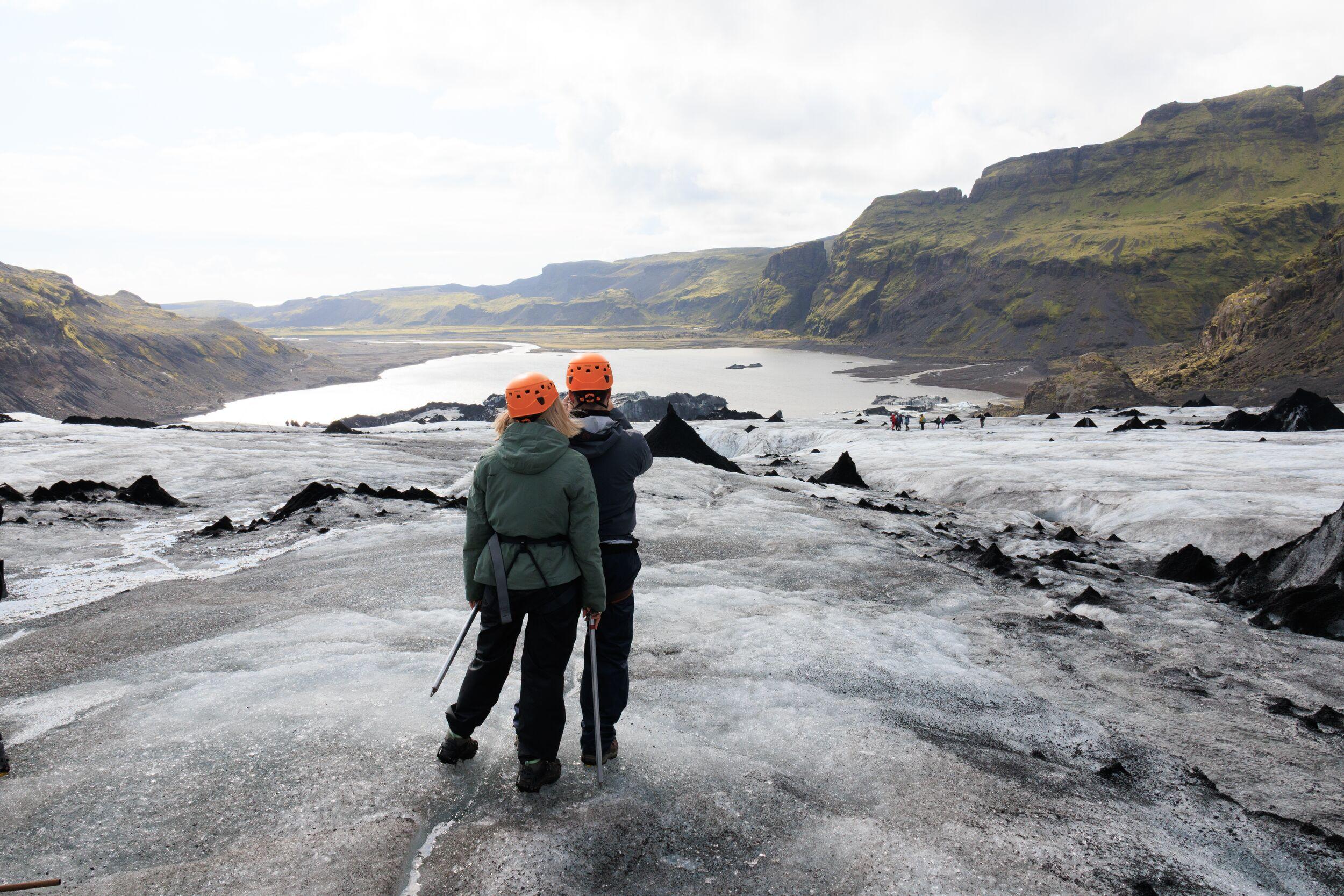 two people enjoying the view on a glacier