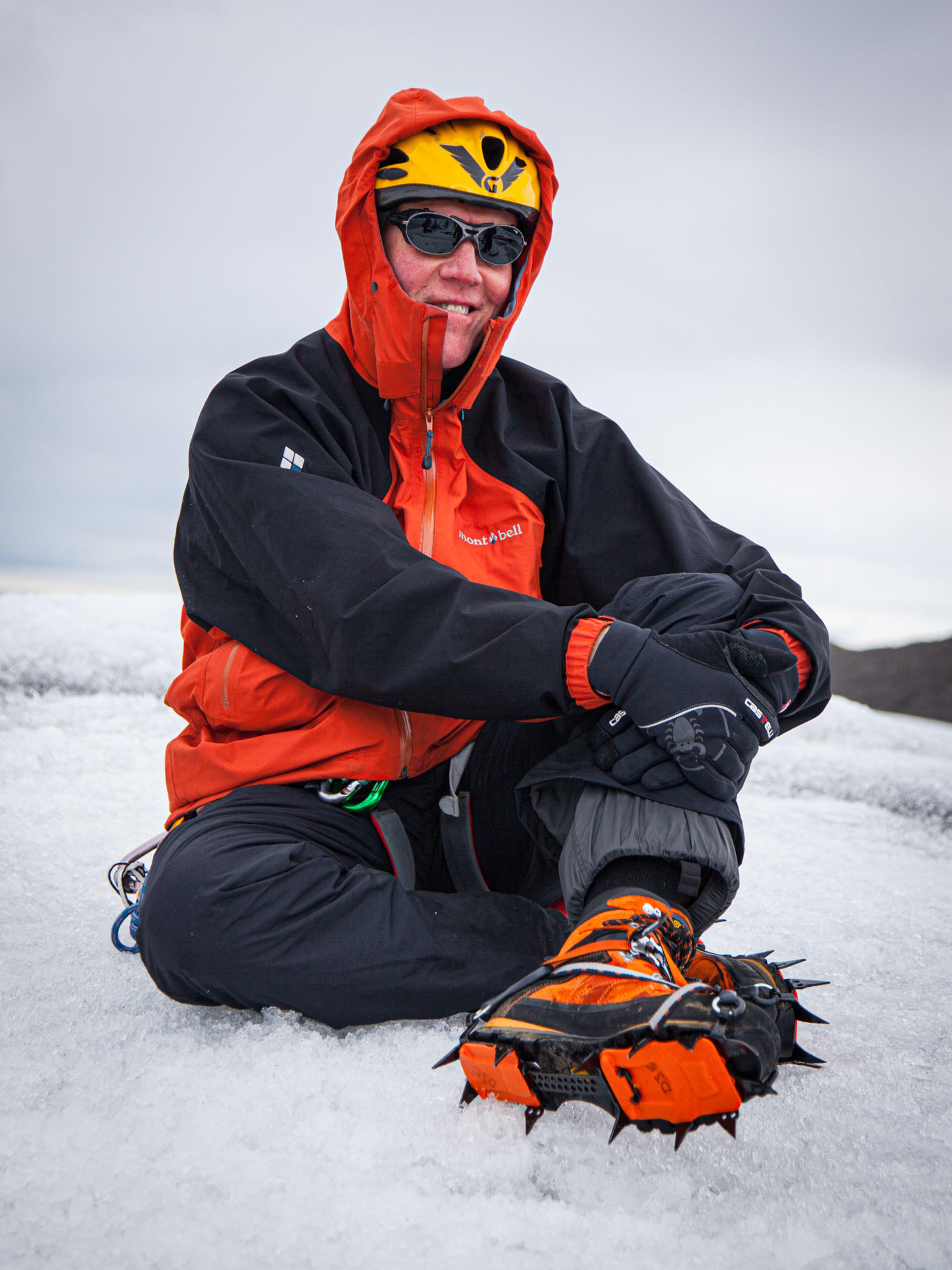 a man in red gear in the snow 