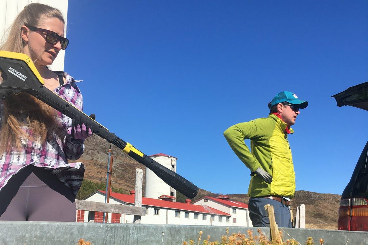 A woman watering saplings ready to be planted in Iceland
