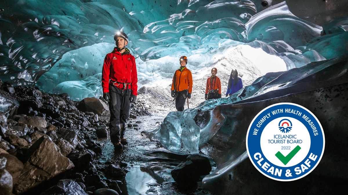 Group inside an ice cave clean and safe logo