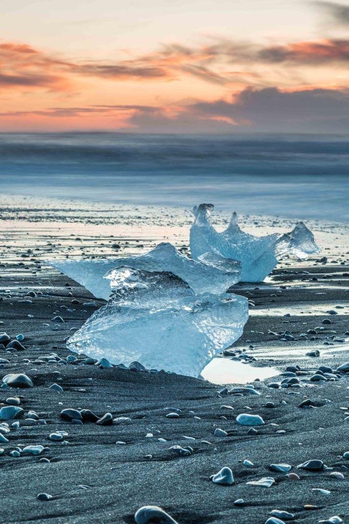 Big chunks of clear ice on a black sand beach in Iceland
