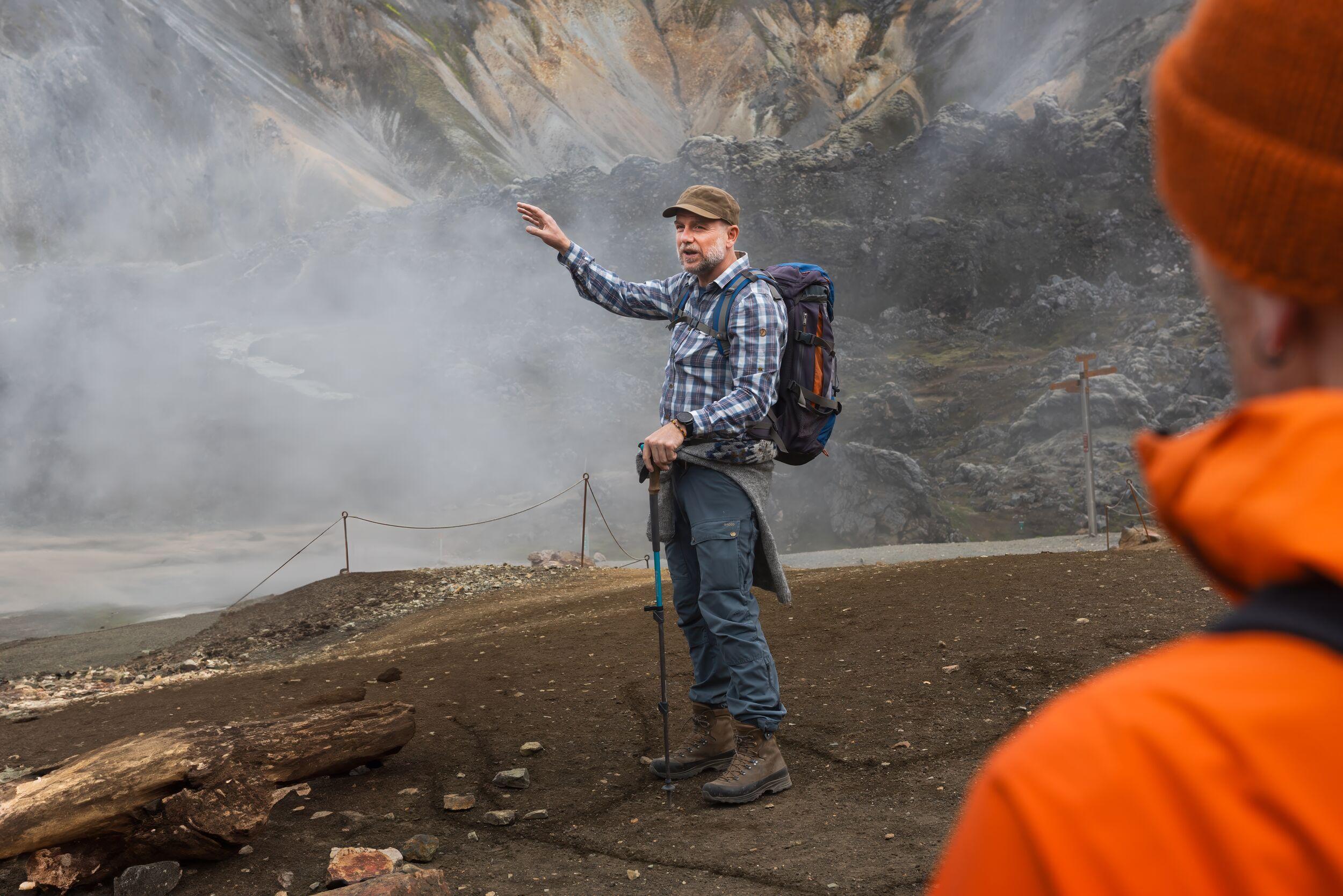 A guide during the Laugavegur trek in a steamy geothermally active landscape