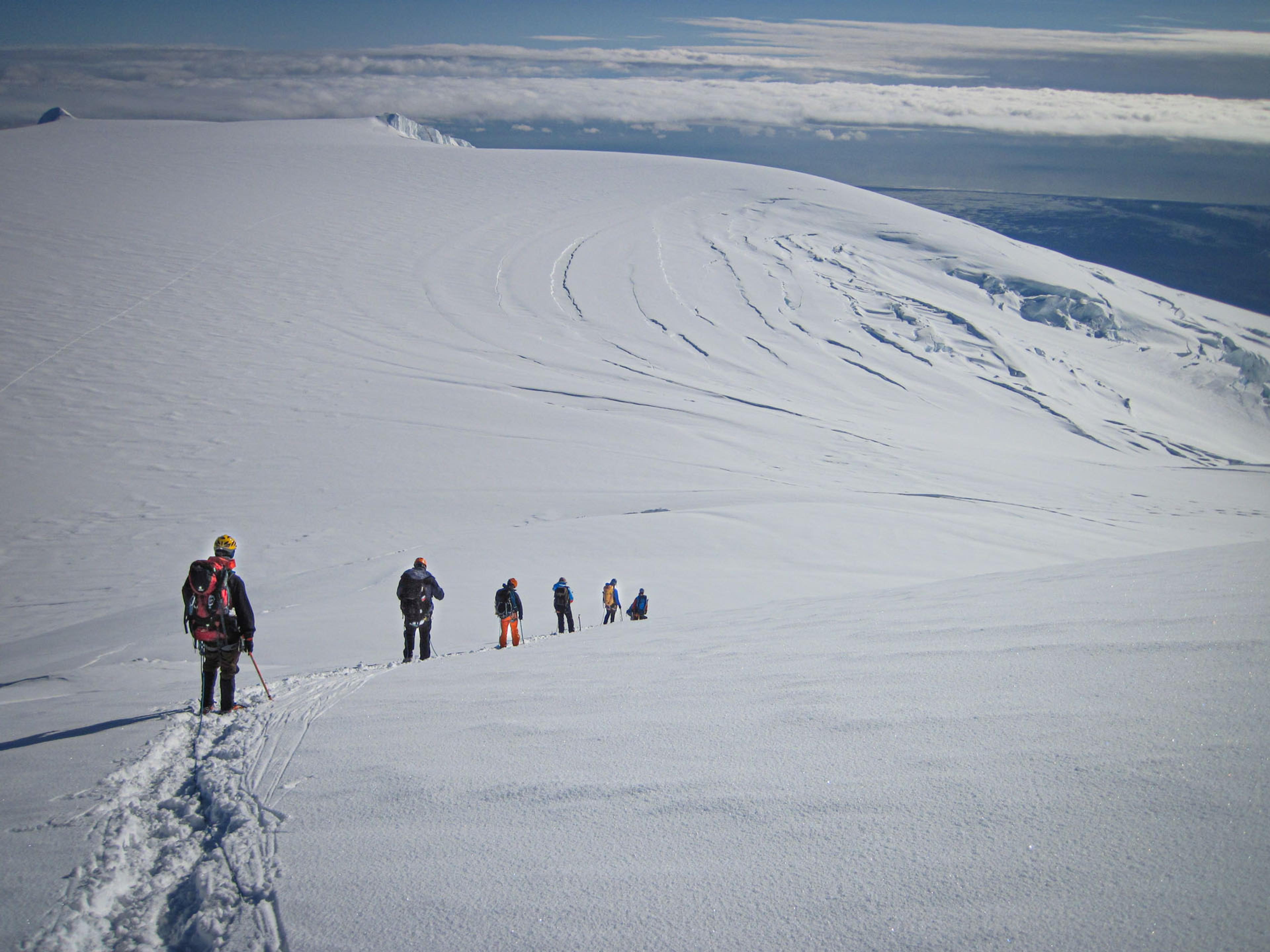 People walking in line in the snow