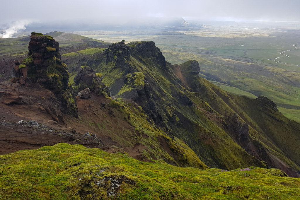 Beautiful view of jagged mountains and green hills