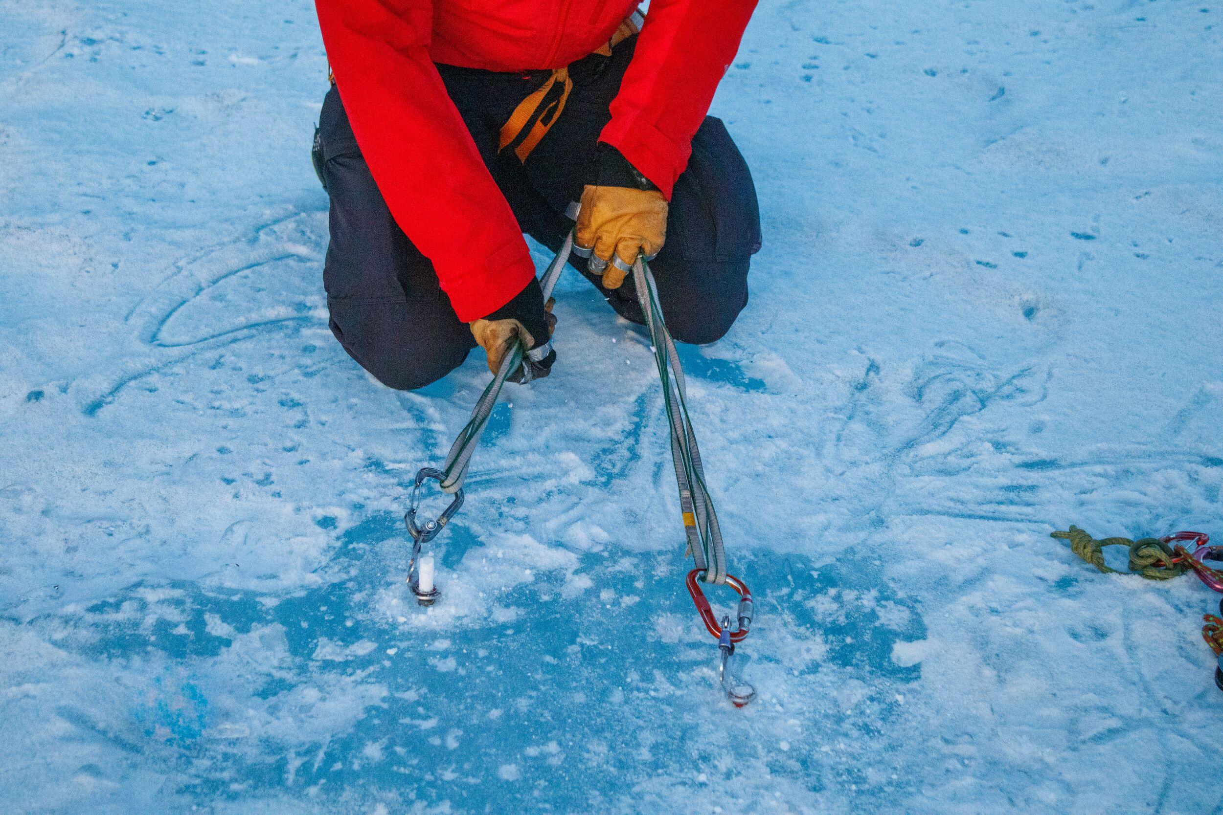 A harness anchored in the ice for ice climbing