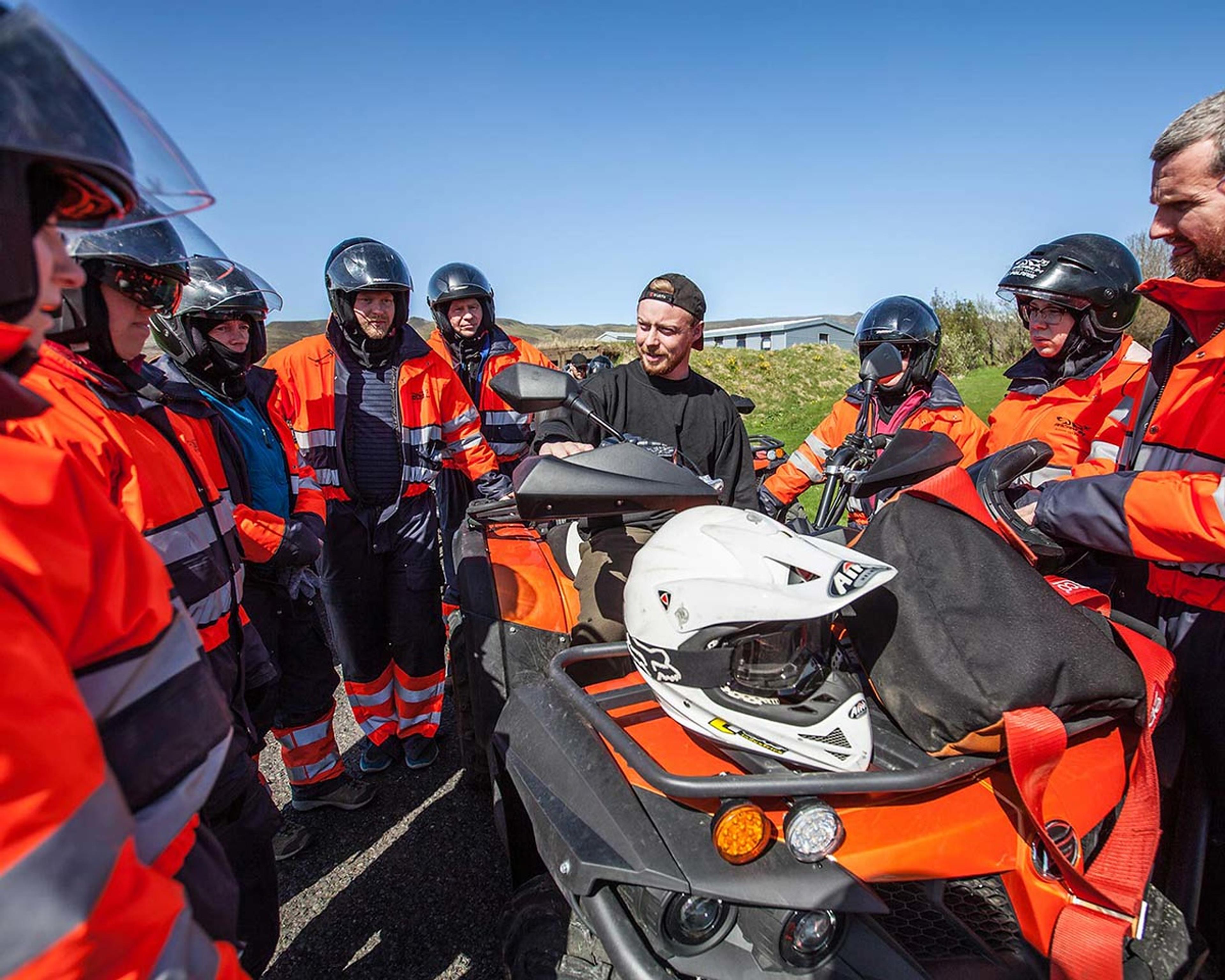 The guide showing the guests how to operate the quad bike