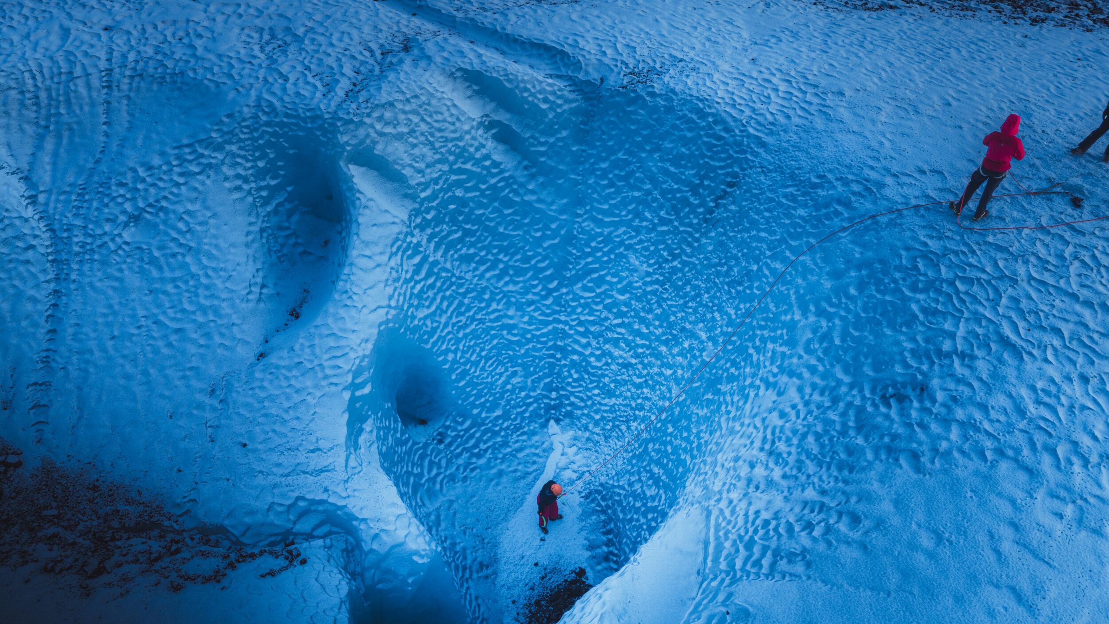 People ice climbing 