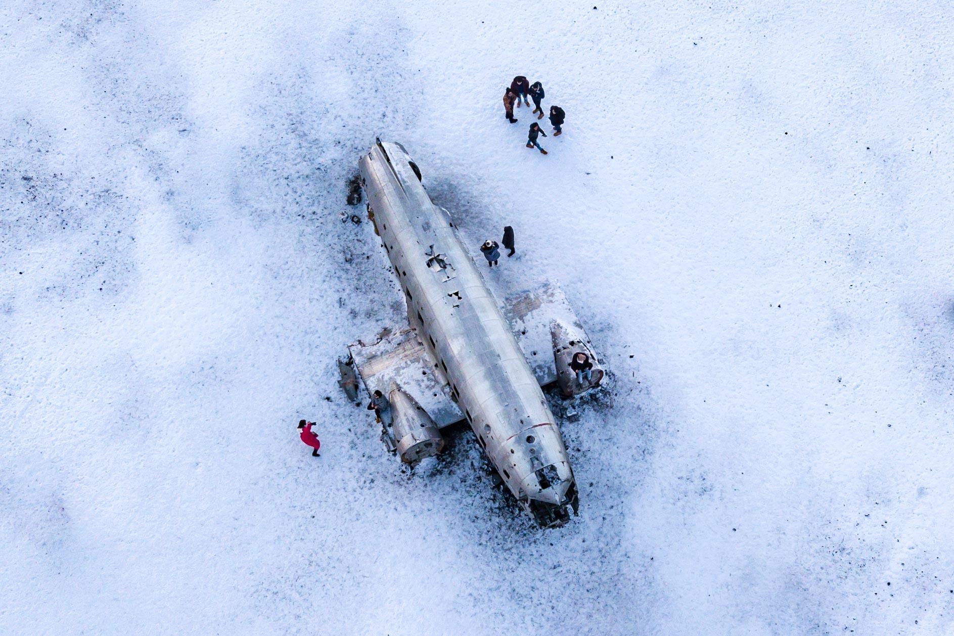 drone shot of the dc3 plane wreck in winter and the sand is all white