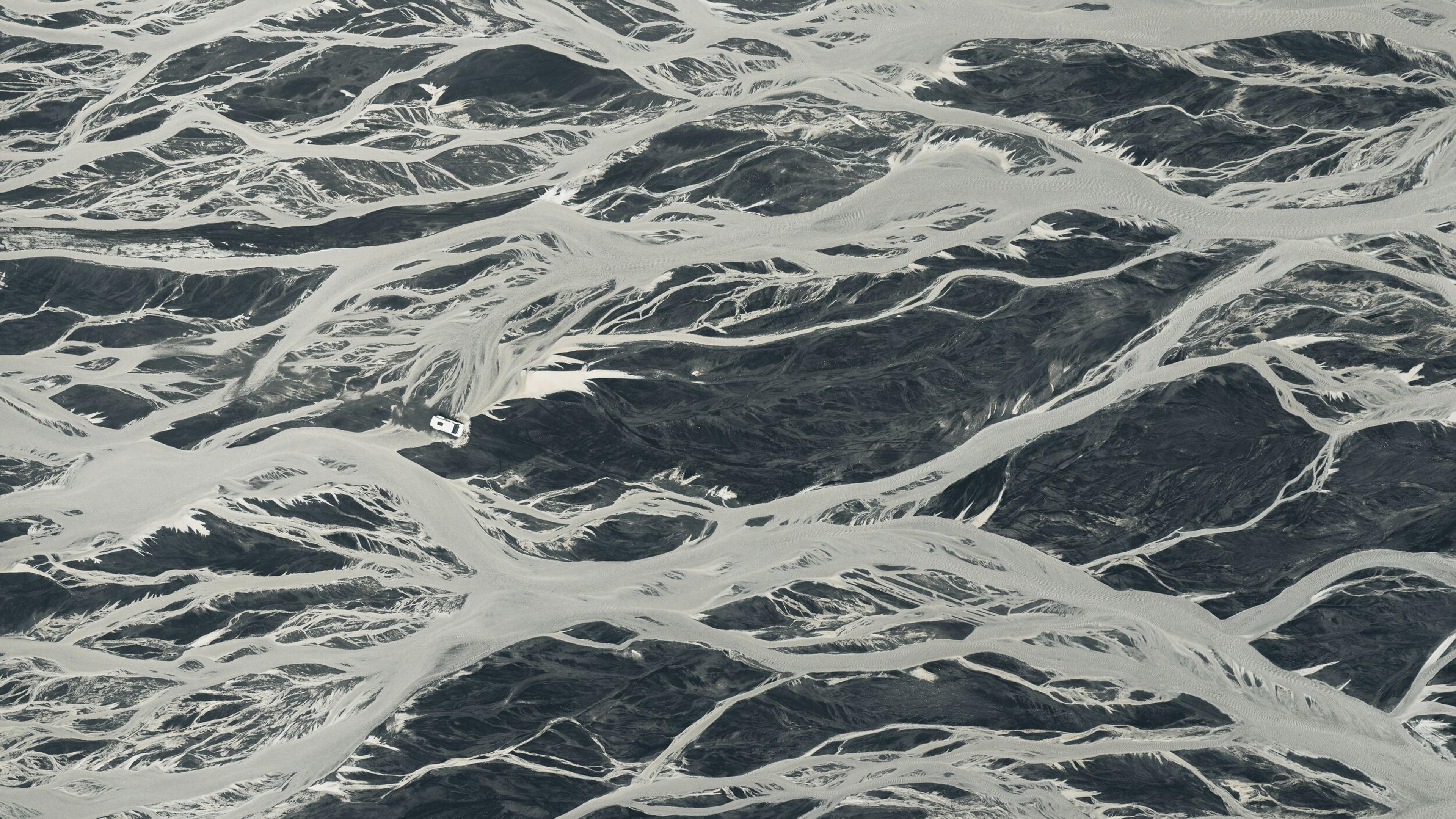 River on a black sand