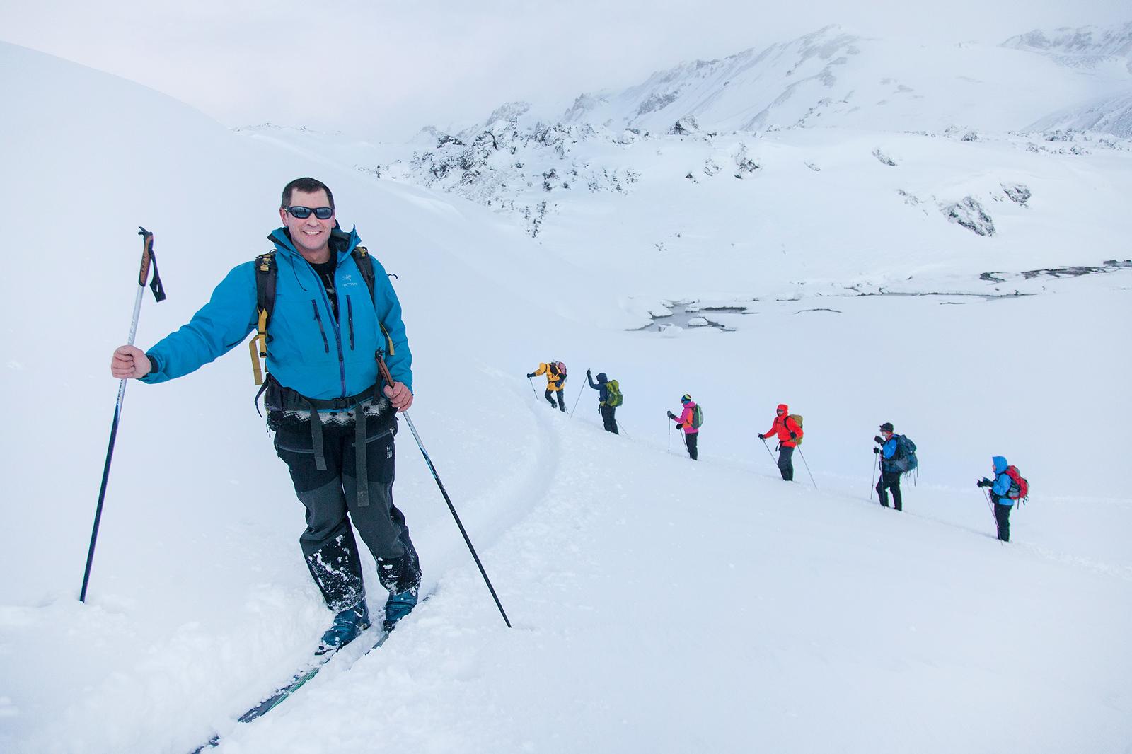 Hikers skiing in mointains in Landmannalaugar
