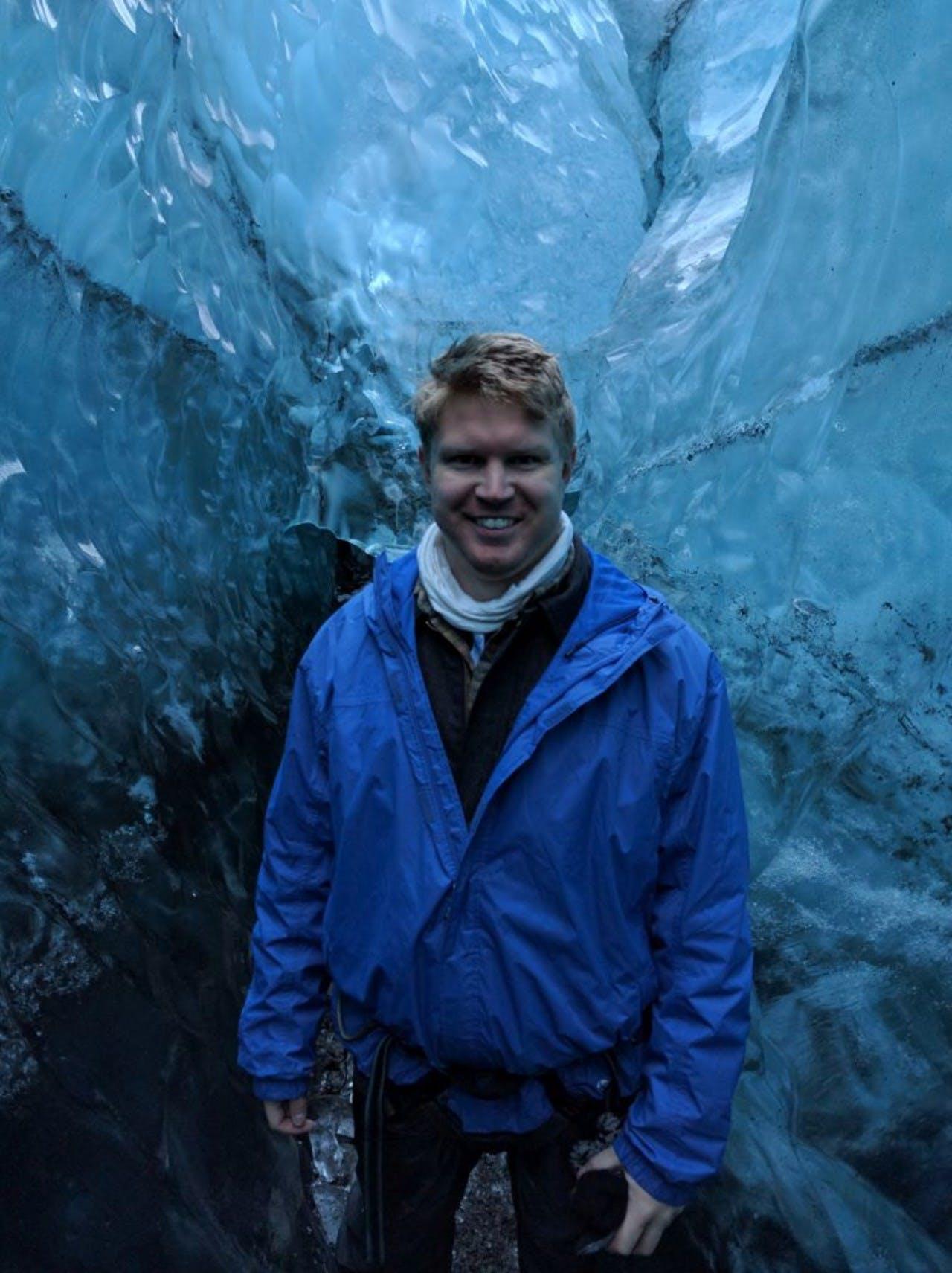 smiling Aaron in an ice cave
