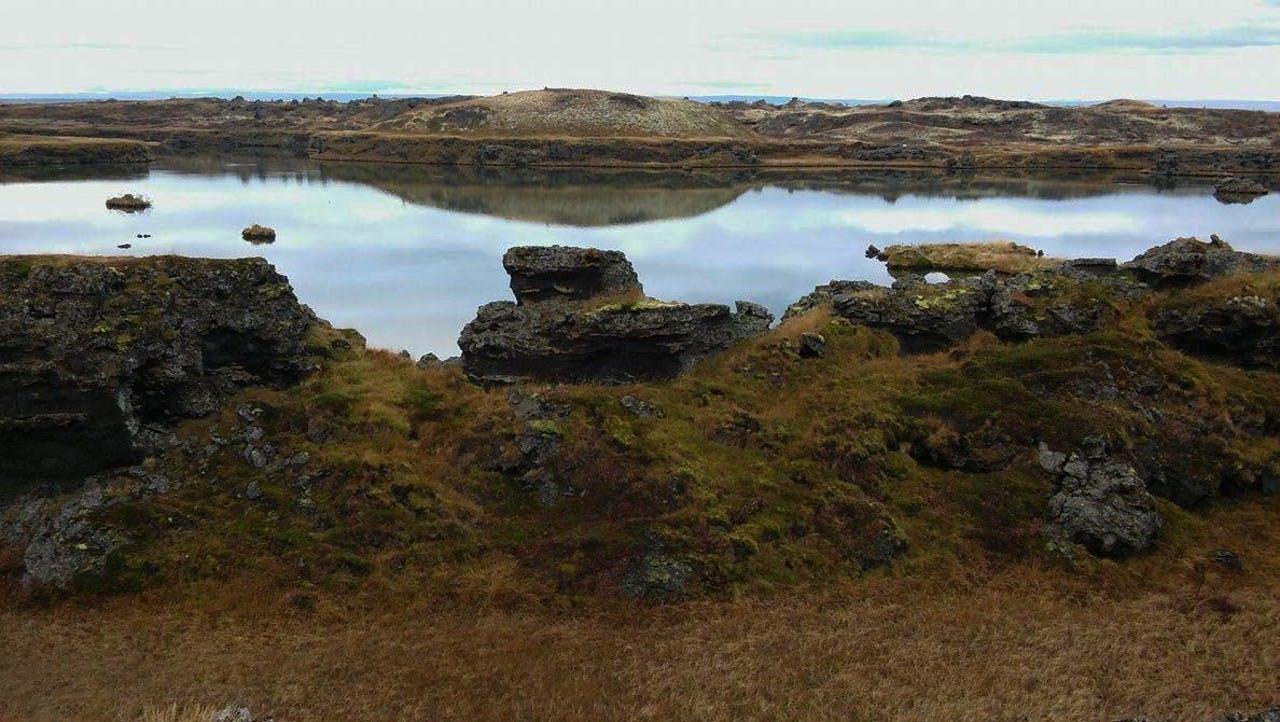 Beautiful lake on a summer day in Iceland, lava and mosi in the foreground