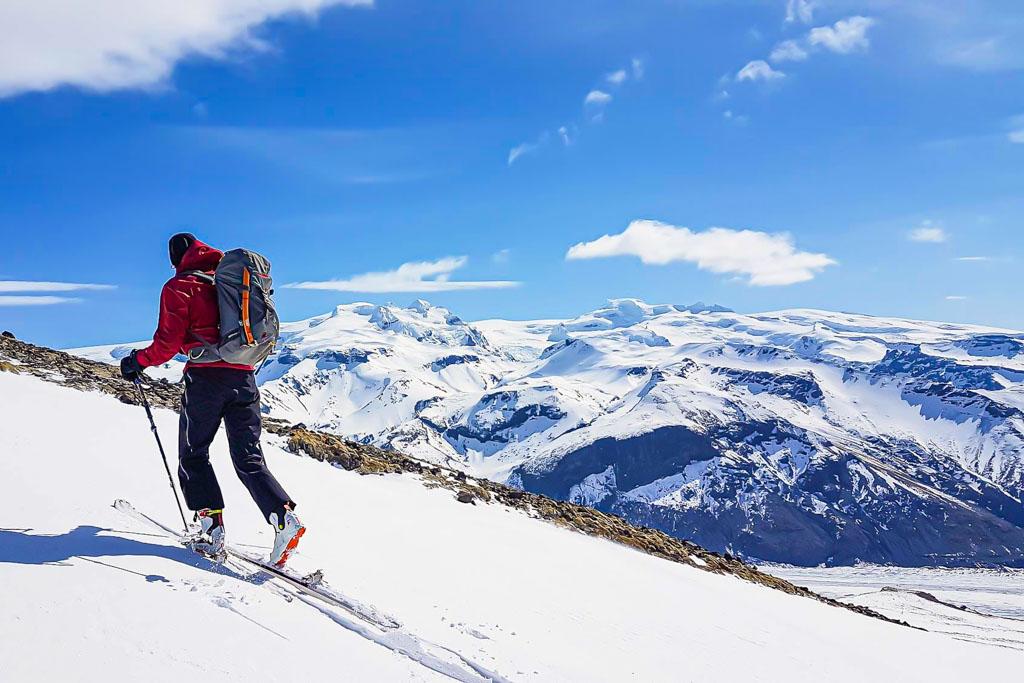 Skier with Hvannadalsnukur, Iceland's highest peak, in the background