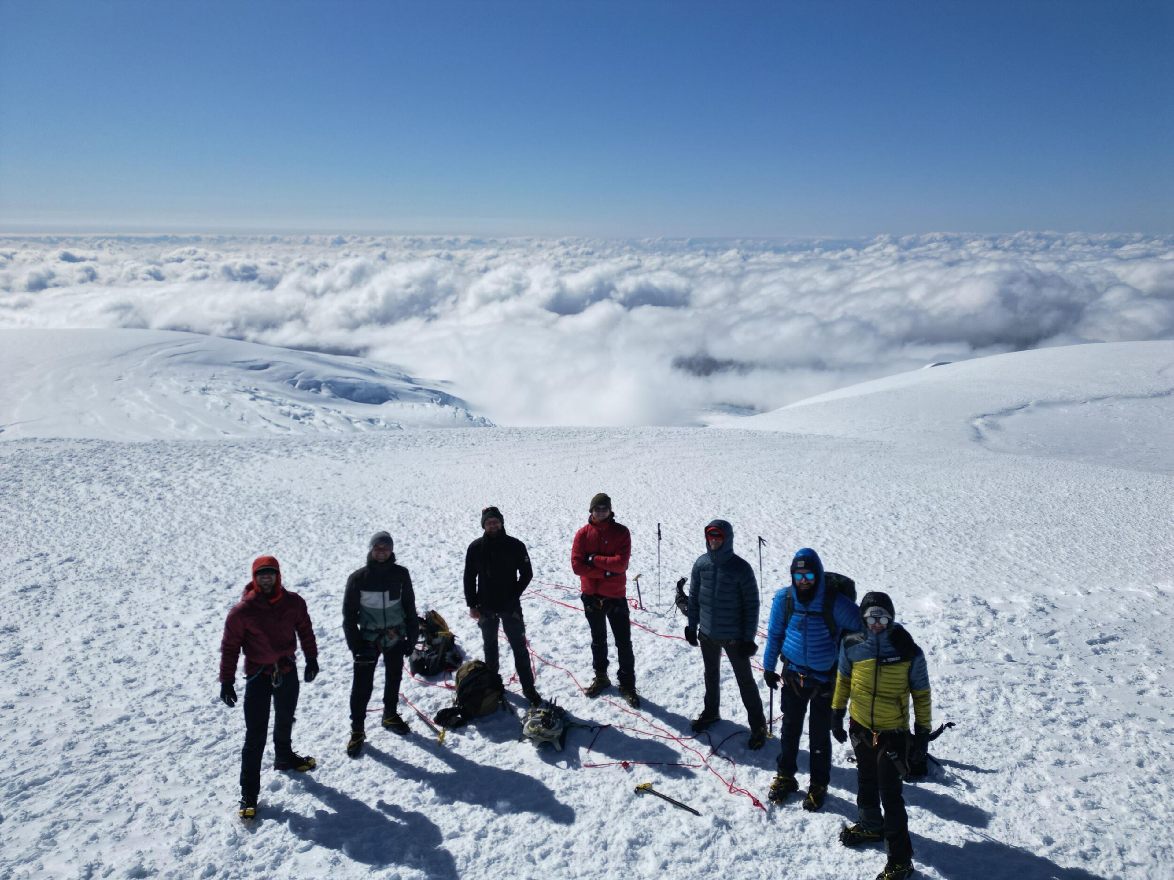 A group of hikers above the clouds on the ice cap on their way to summiting Hvannadalshnúkur