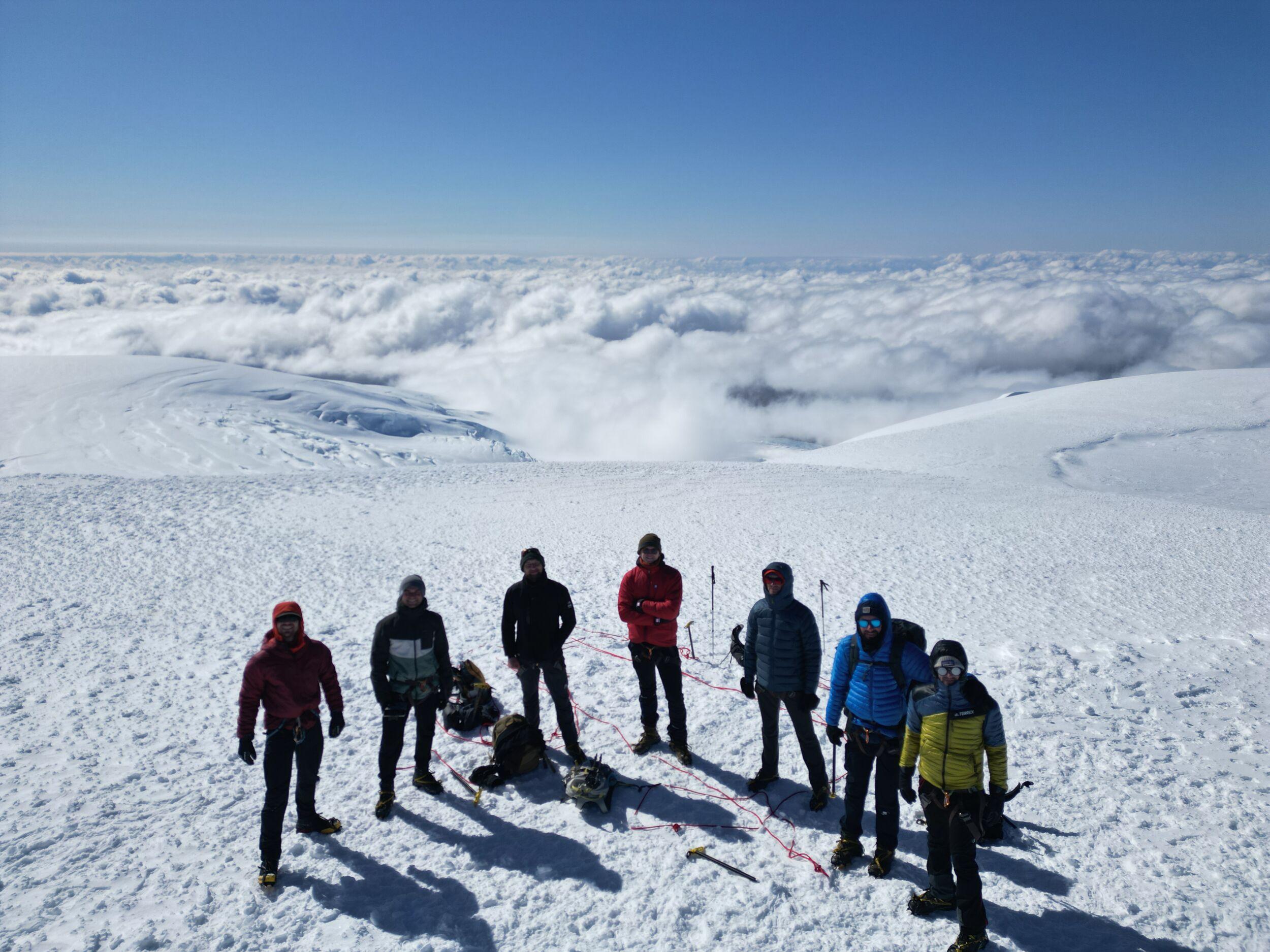 A group of hikers above the clouds on the ice cap on their way to summiting Hvannadalshnúkur