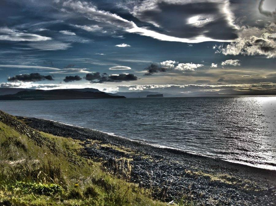 Beautiful black beach with mountains in the distance, Þórðarhöfði