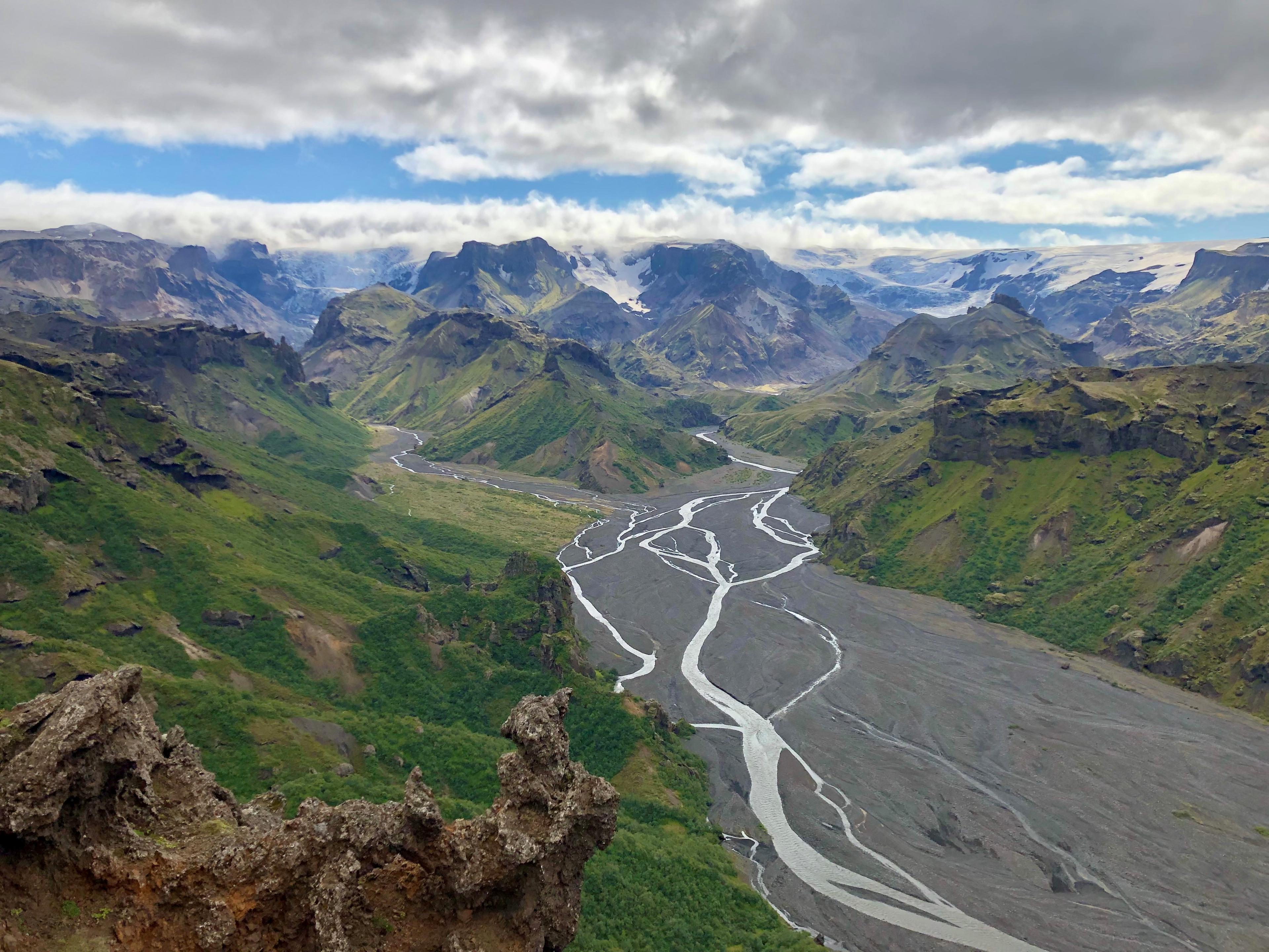 A view of Thorsmörk valley and Skogar with streams and lush grass