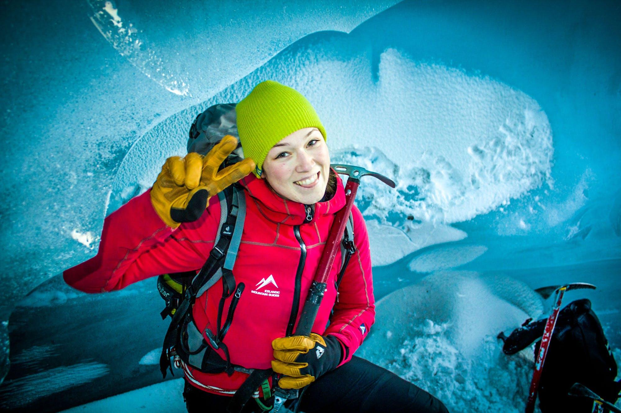 A happy Icelandic mountain guide posing for a picture inside a glacier