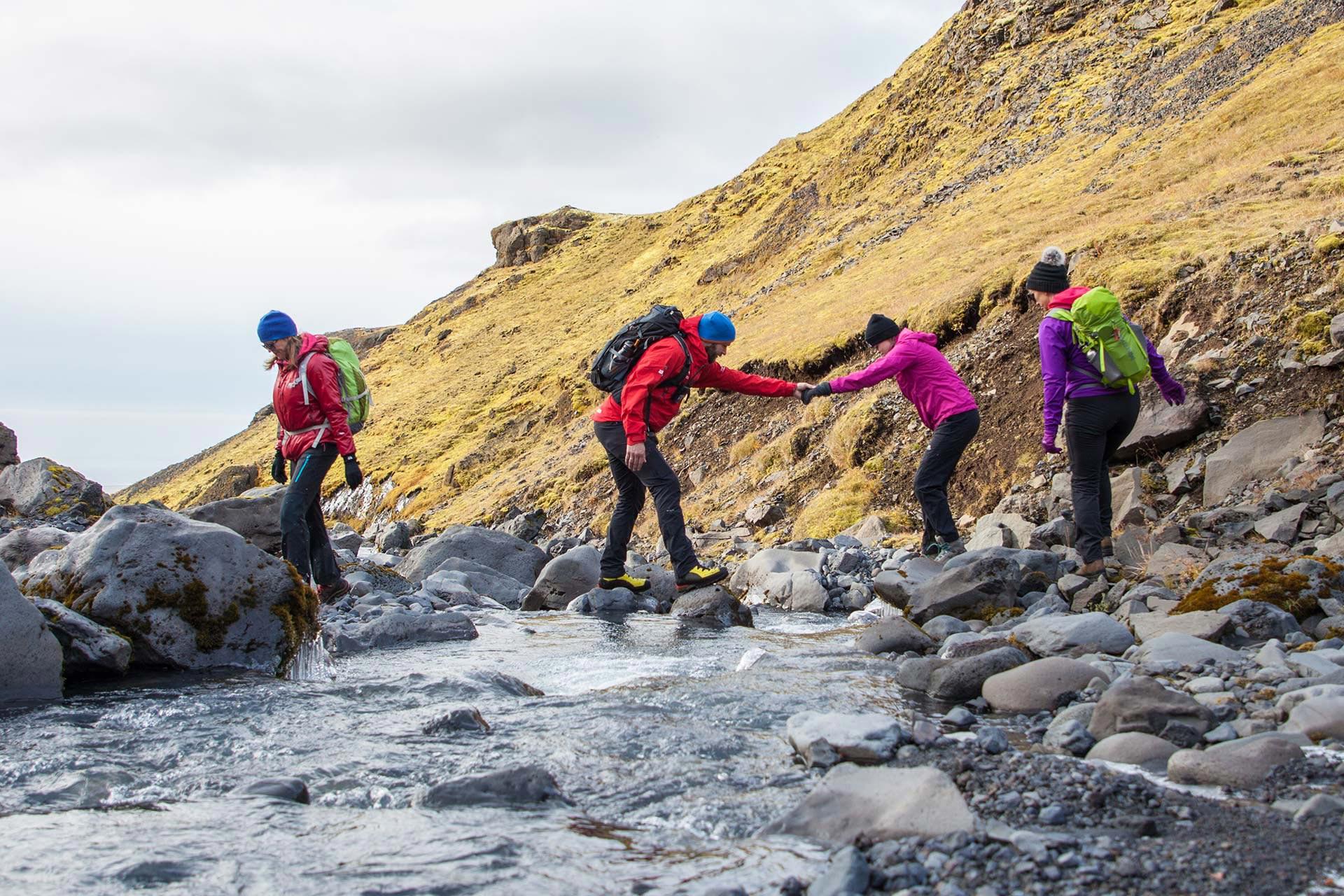 Rivers on the way and the guide helps his guest to cross over them
