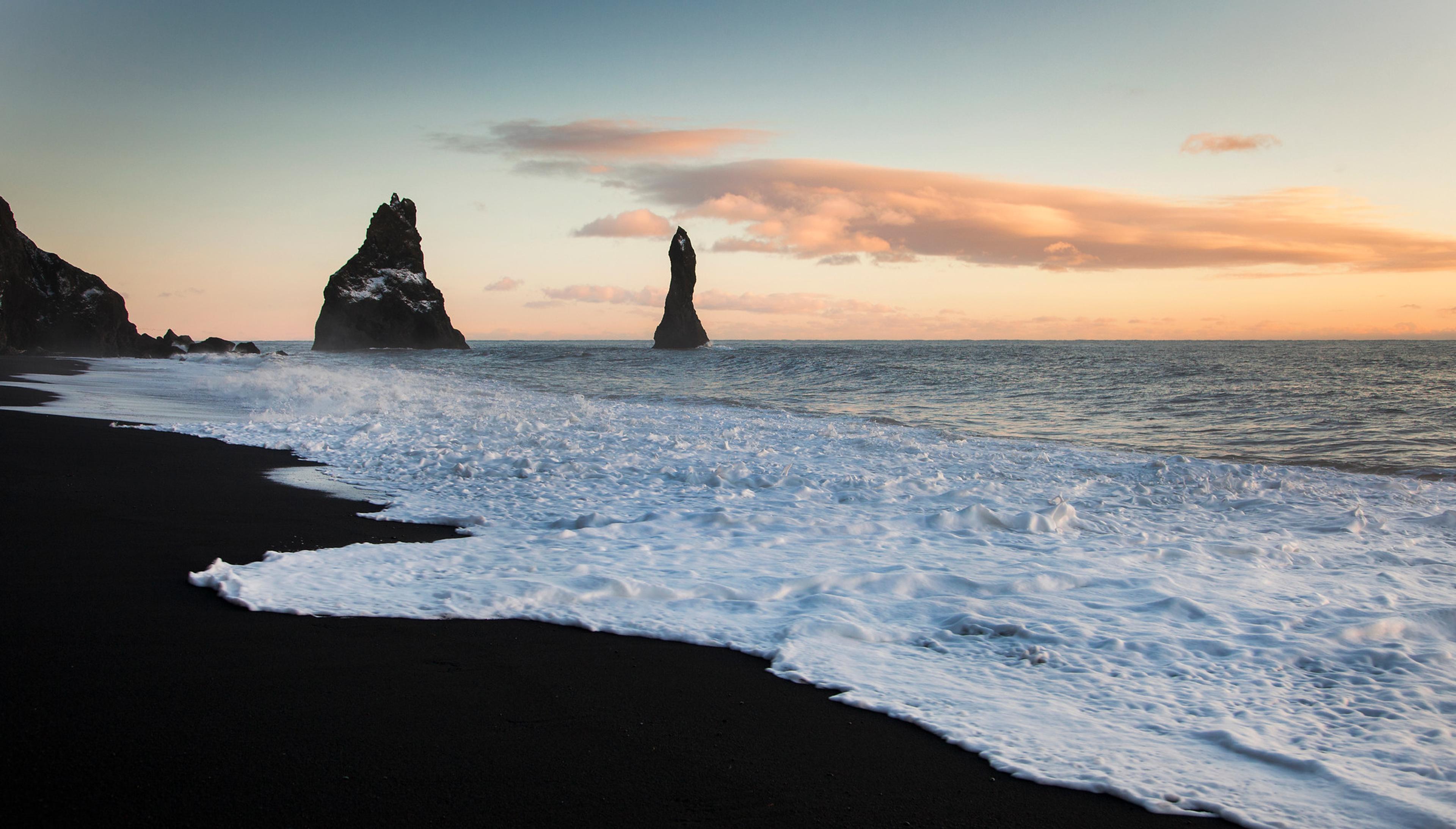 The beautiful Reynisfjara a black sand beach during the sunset