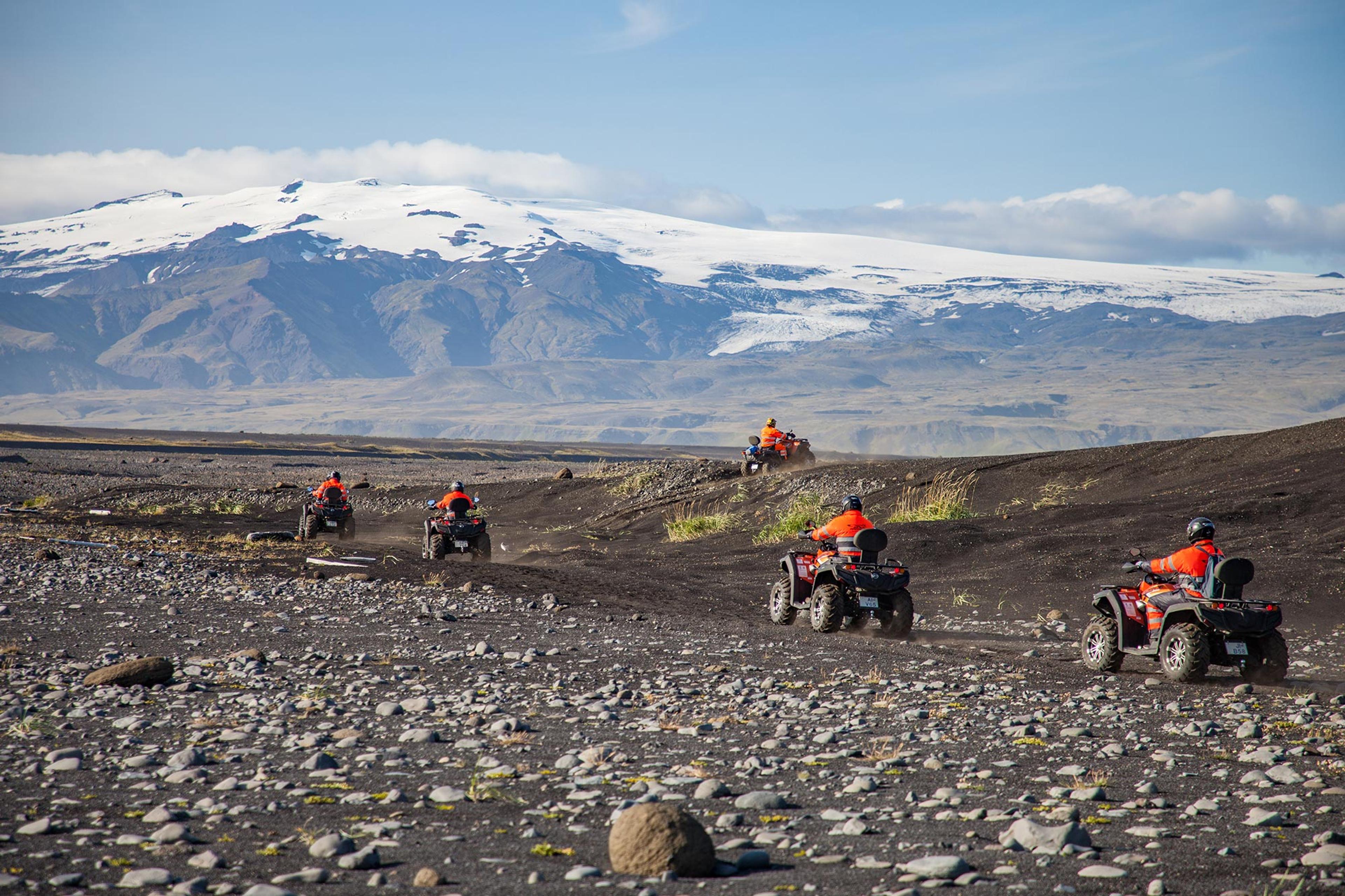 Riding on the black sand on an ATV quad bike having the fantastic view of Eyjafjallajökull glacier in front