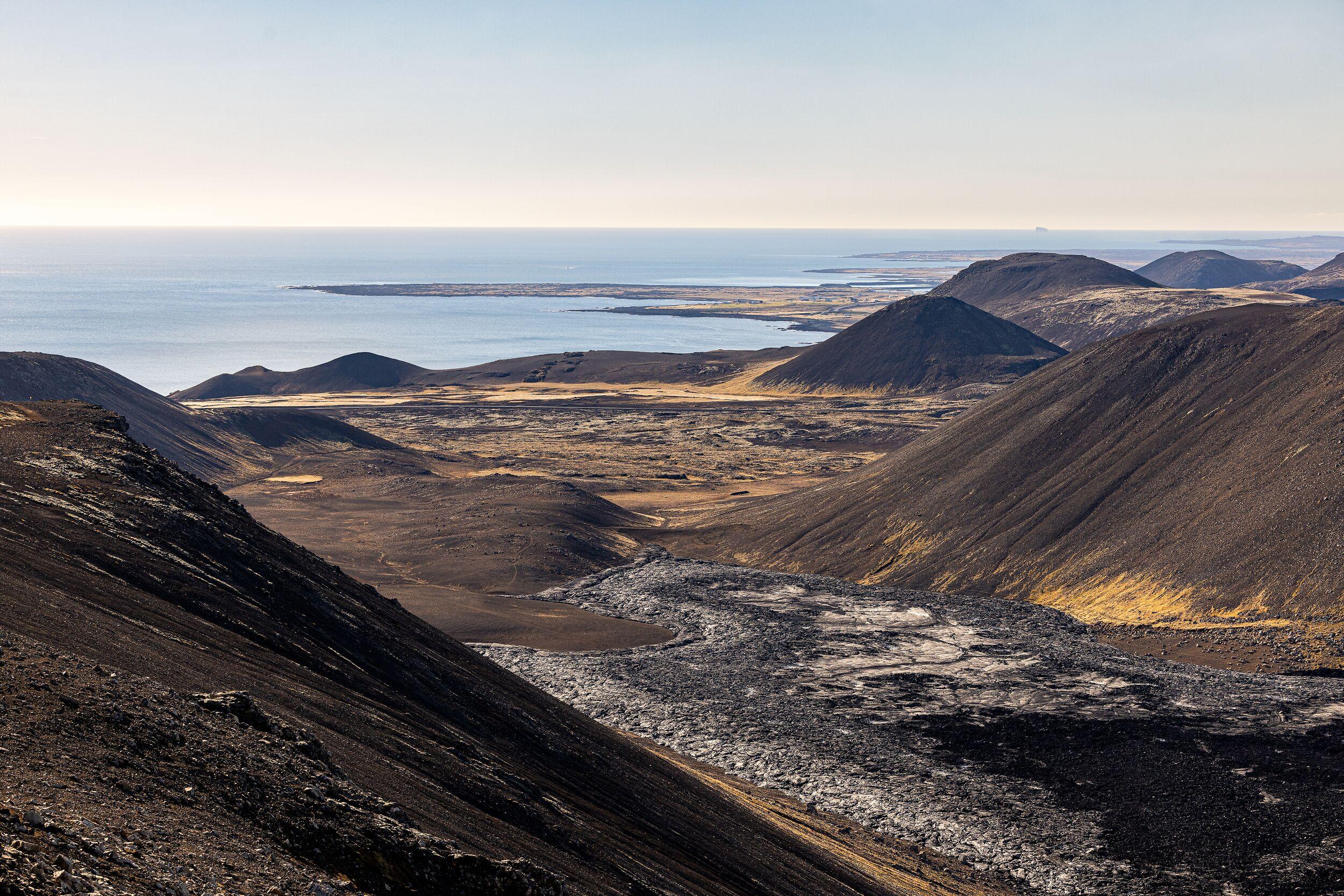 Volcanic terrain stretching towards the horizon on Reykjanes Peninsula.