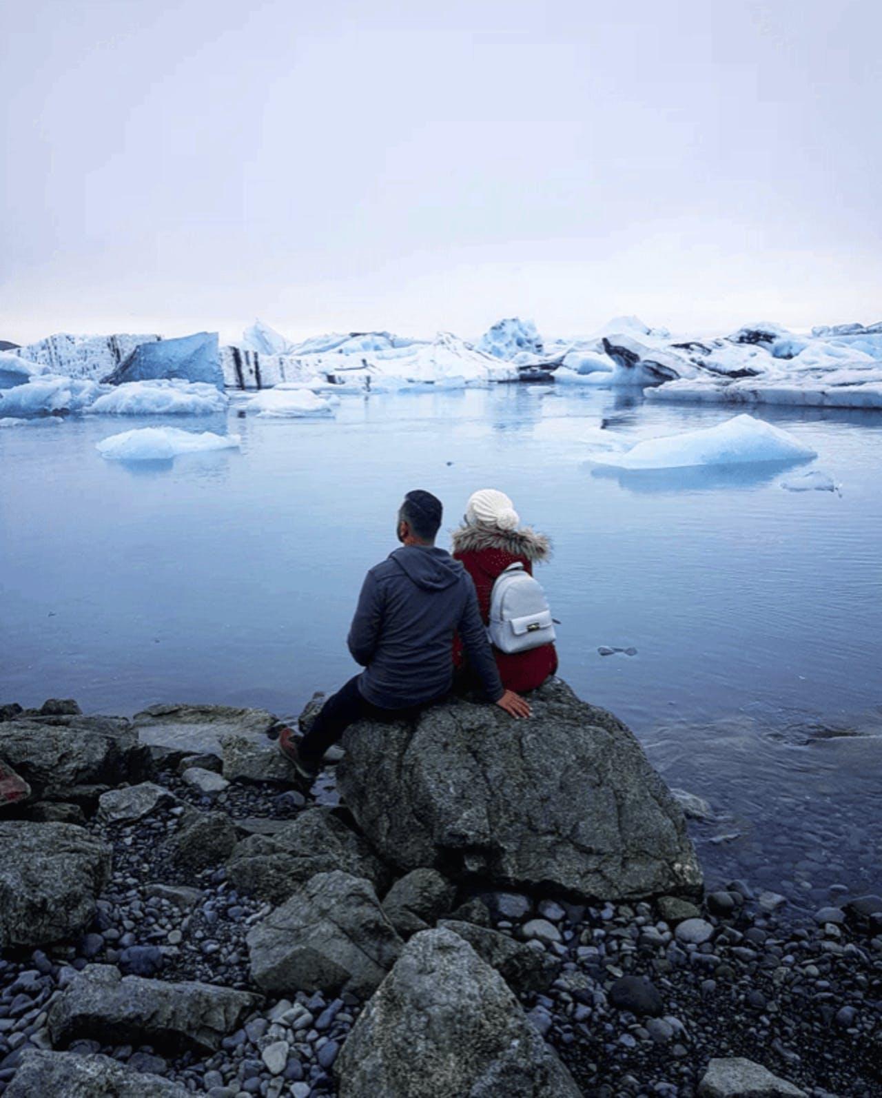 A couple looking out at Jökulsárlón Glacier Lagoon