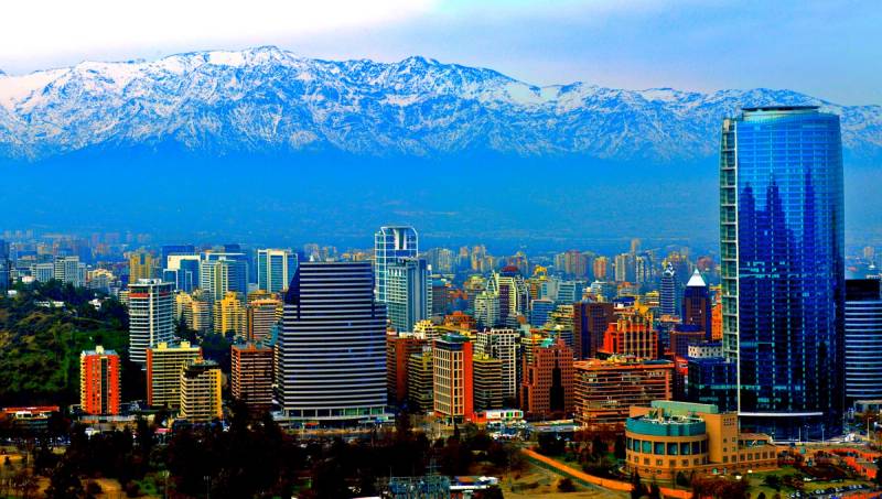 Santiago’s skyline at dusk, glass towers against the snow-capped Andes