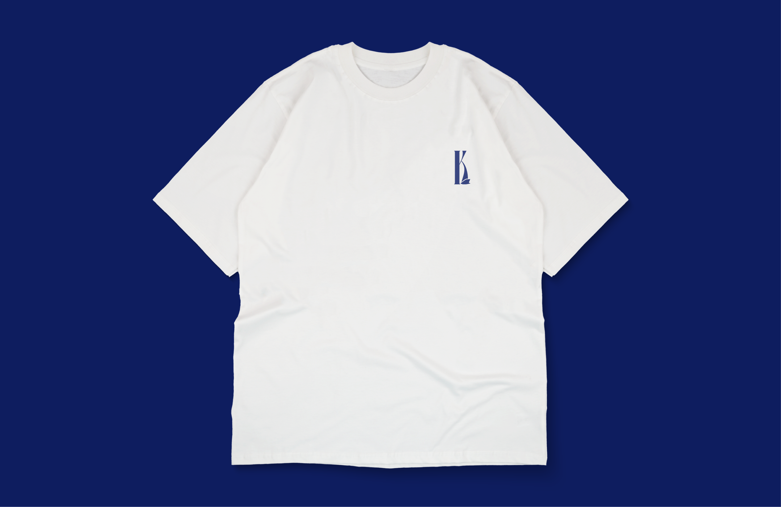 A white T-shirt with a small K monogram on the chest, on navy.