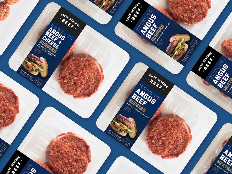 Green Meadows Beef burger and meatball packs arranged in a grid on a blue background.