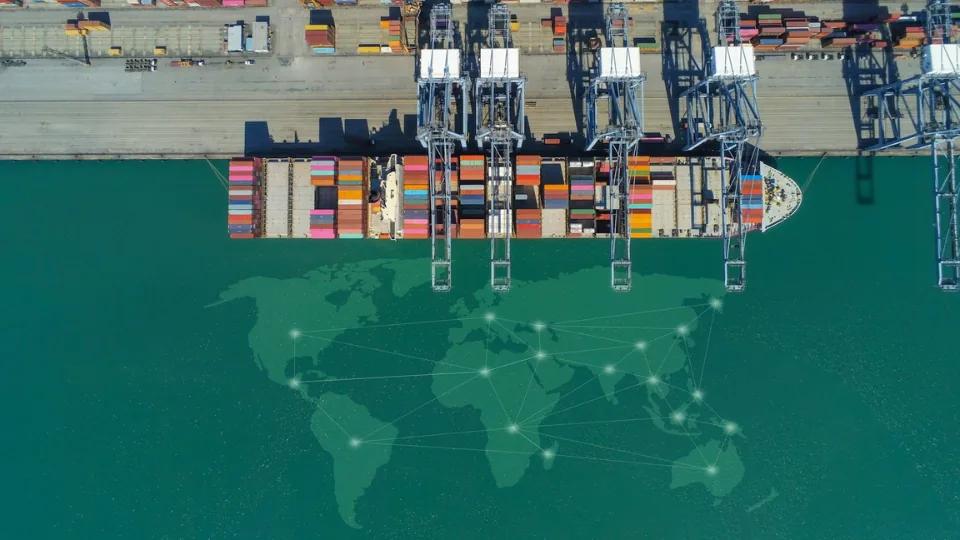 Cargo ship and global trade map