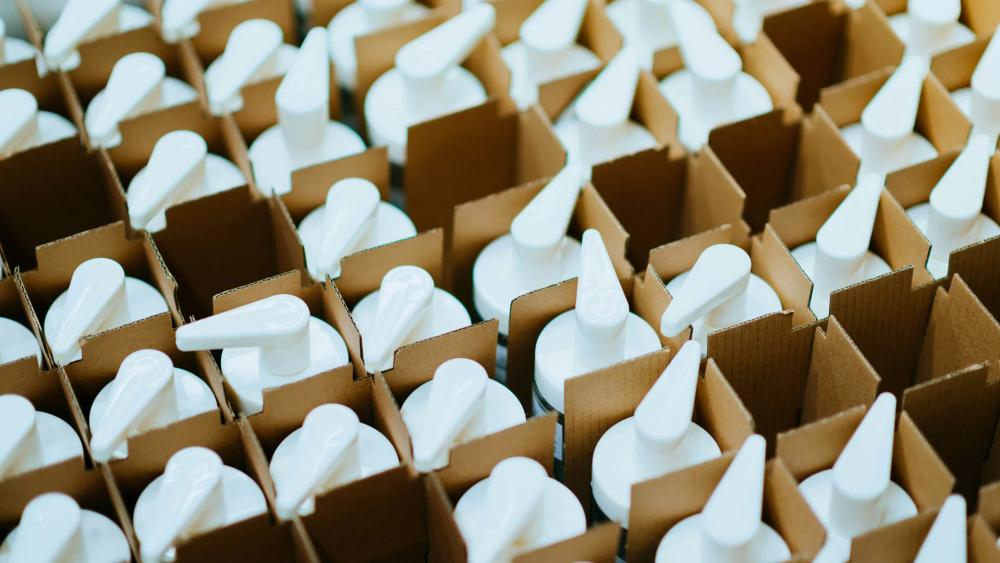 White plastic pump bottles and packaging