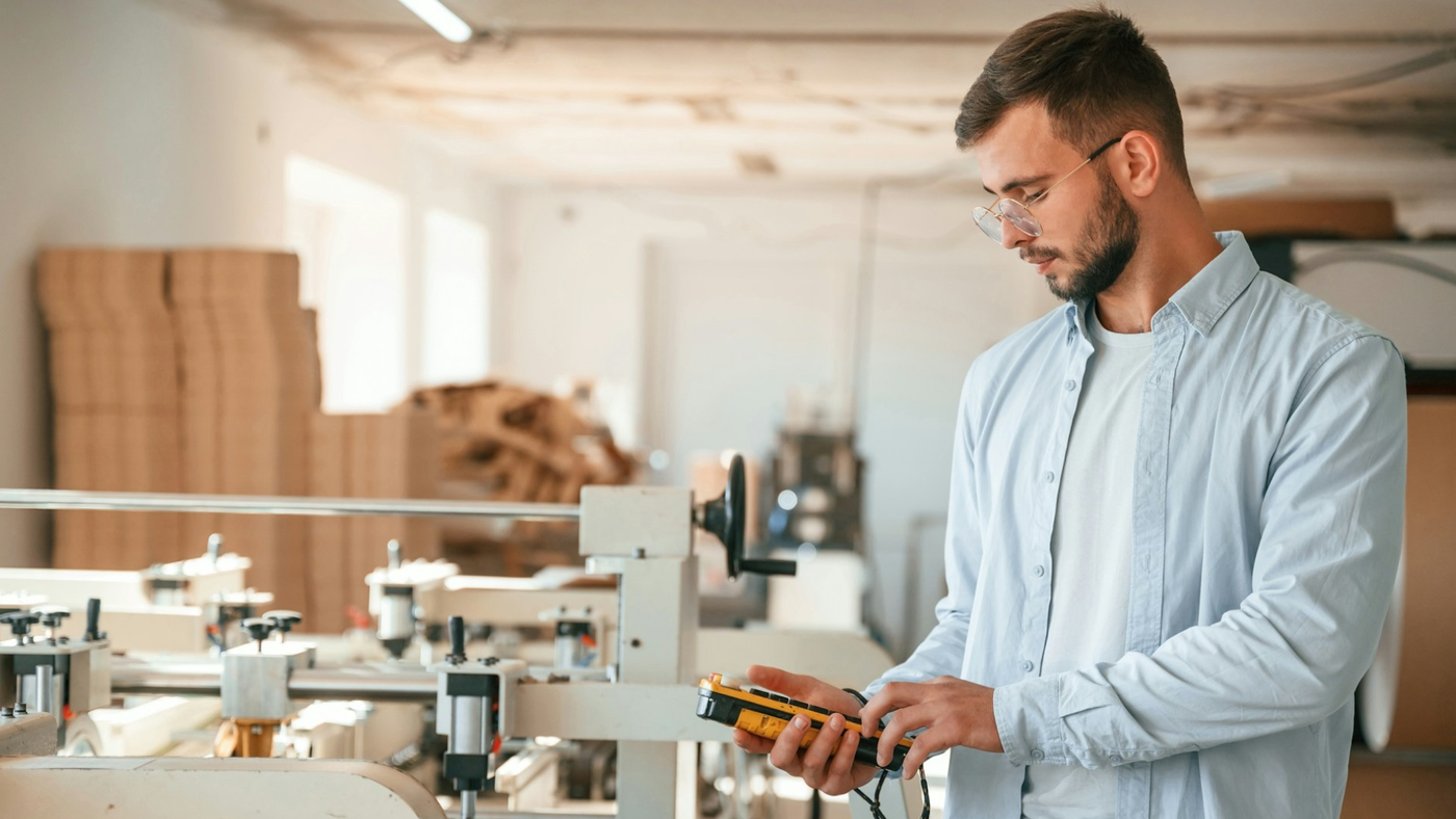 Man inspecting packaging production line