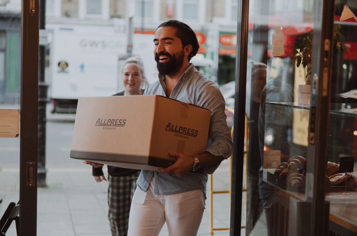 Allpress Wholesale Coffee webpage featuring a barista, coffee products, and espresso offerings.
