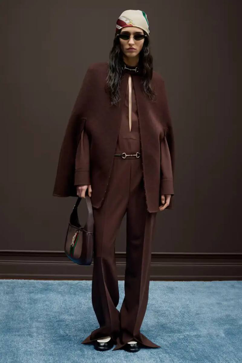 Gucci Fitted Gucci blazer in muted tone, cinched at the waist with precise tailoring, showcasing structured silhouette with soft leather details
