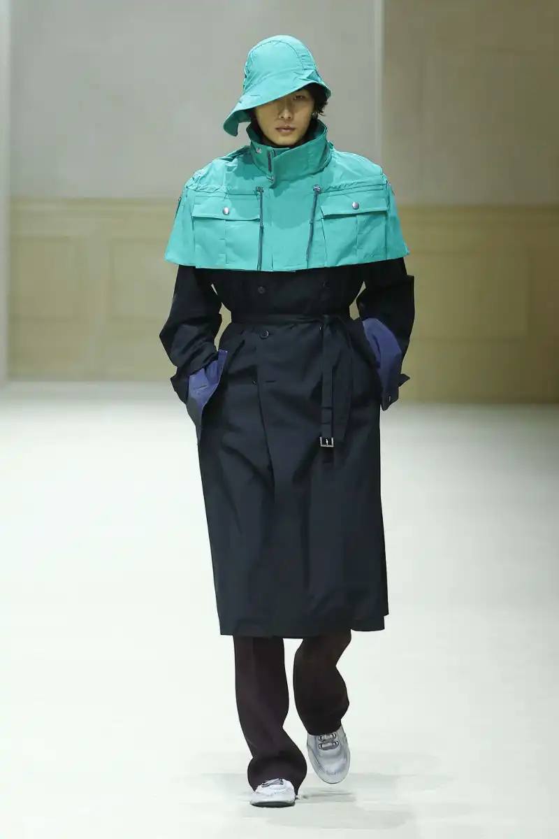 PRADA FALL/WINTER 2026 MENSWEAR REVIEW Analysis of Prada's Fall/Winter 2026 menswear collection presented in Milan, featuring structured tailoring, pastel color palette, and classical architectural influences.