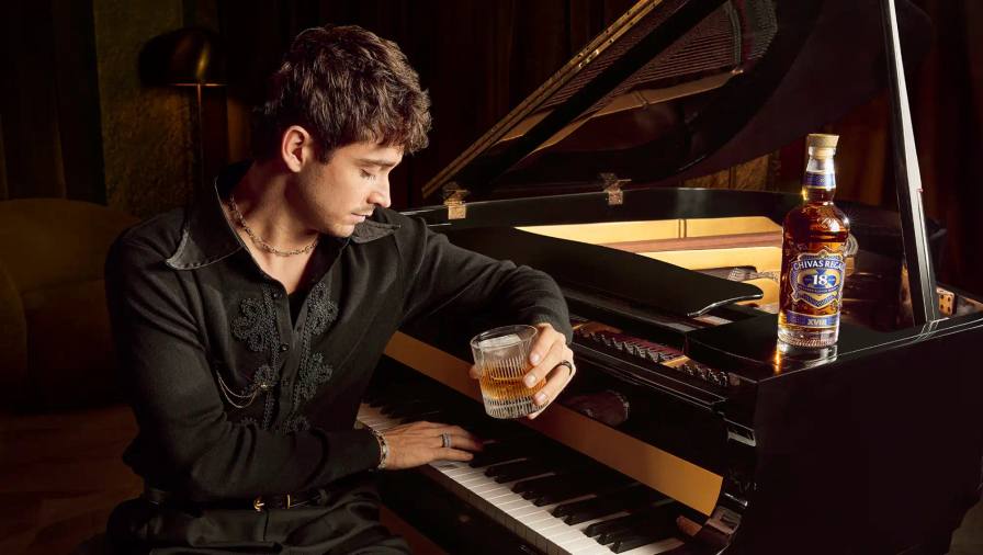 CHARLES LECLERC PARTNERS WITH CHIVAS REGAL 18 image about Formula 1 driver Charles Leclerc's partnership with Chivas Regal whisky brand, focusing on his musical interests and the Chivas Regal 18 product.