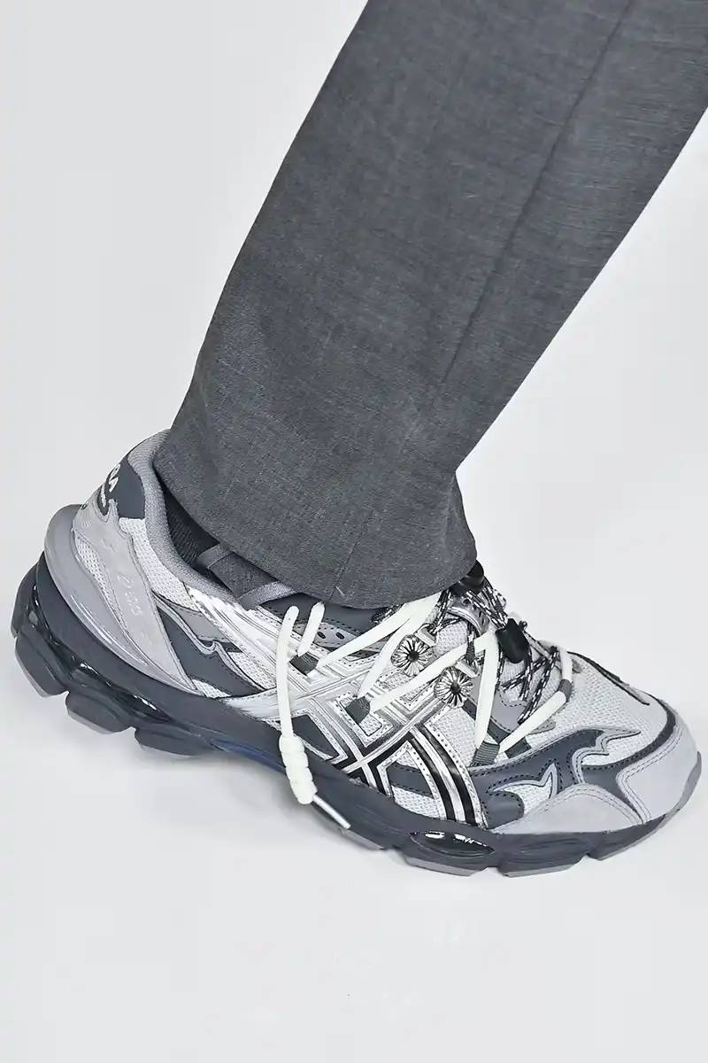 TOGA x ASICS collaborative sneakers featuring decorative appliqué, dual lacing system, and ornamental hardware in gray, silver/red, and earth tone colorways.