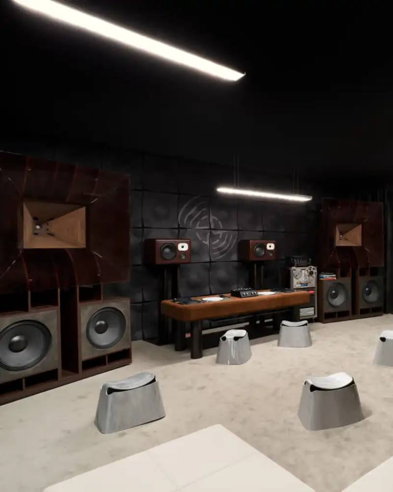 STONE ISLAND'S CUSTOM SOUND SYSTEM TAKES CENTER STAGE AT MILAN DESIGN WEEK picture of Stone Island's audio installation called "Friendly Pressure: Studio One" at Milan Design Week. It details the custom sound system created by London-based studio Friendly Pressure, the specially designed 50-square-meter room optimized for sound dispersion, and the technical components of the high-fidelity audio system. The article also mentions the event schedule and how this project connects to Stone Island's "LAB & LIFE" philosophy of combining technical research with community experiences.