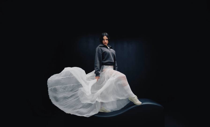 image about the New Balance 204L sneaker campaign featuring Rosalia. The text covers release details, pricing, shoe materials, and design specifications. (image 1 of 4)